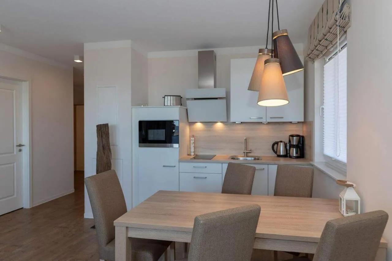 Kitchen or kitchenette in Aparthotel Waterkant Suites - Fewos am Meer mit SPA