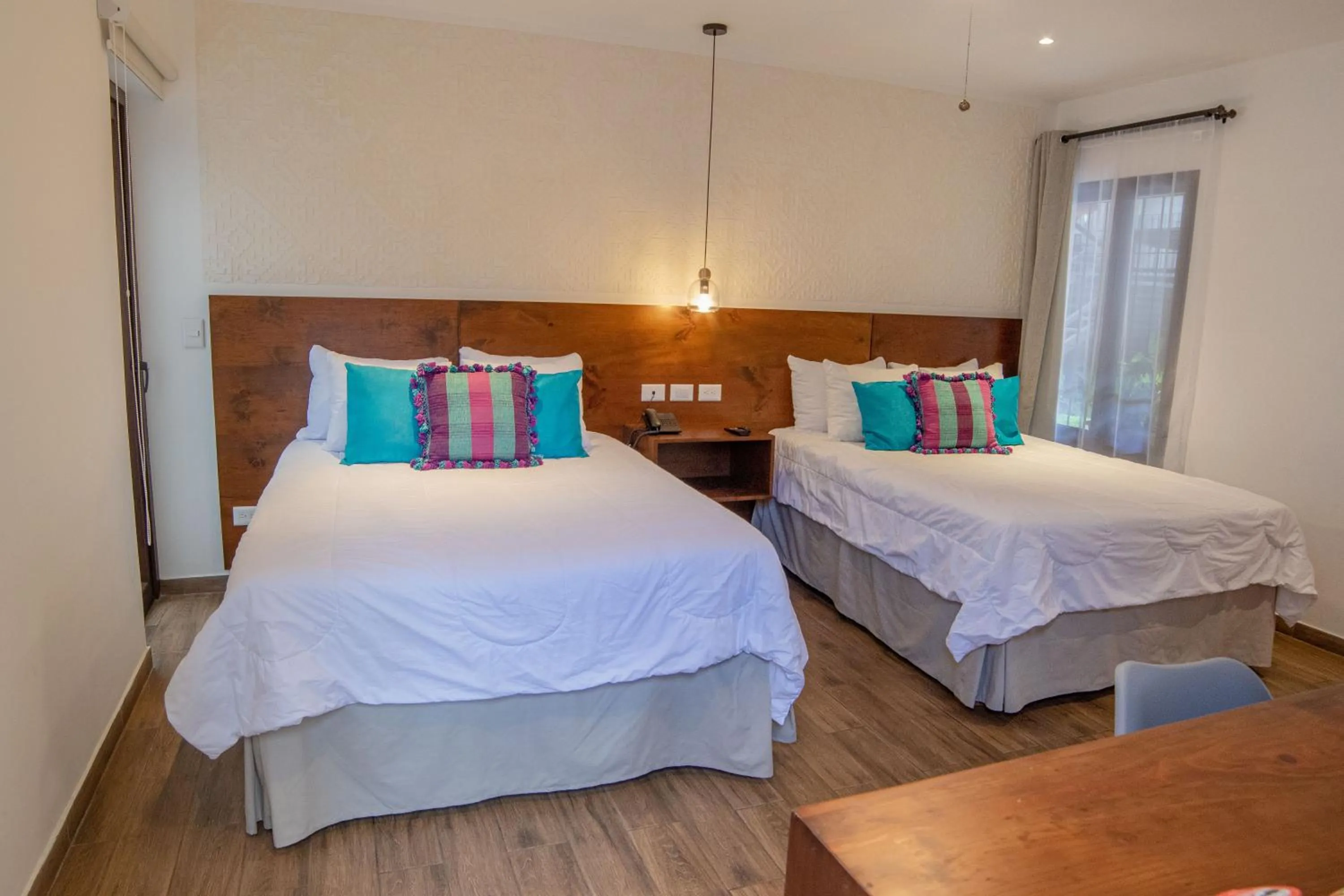 Bed in Hotel Las Camelias Inn by AHS