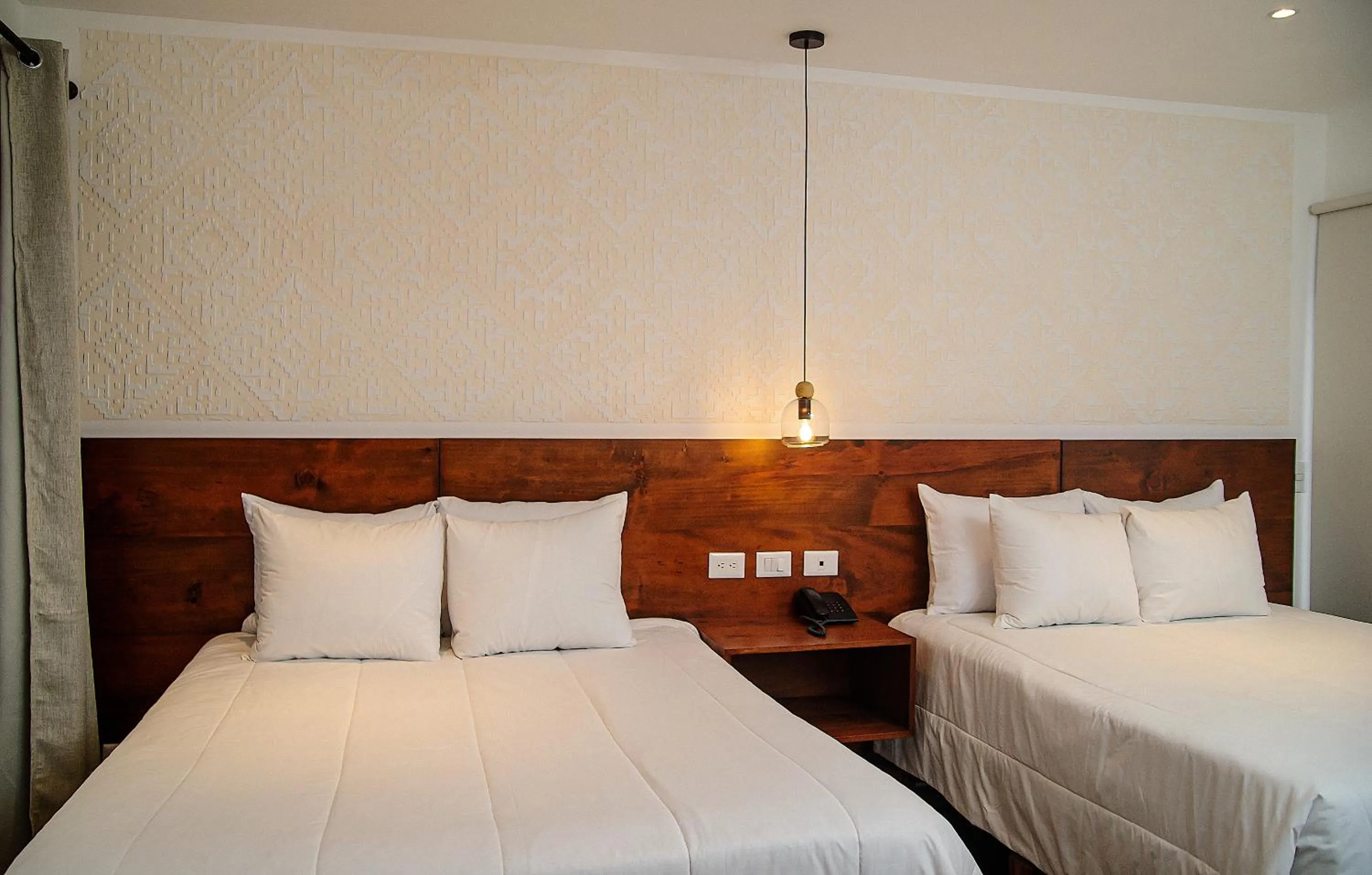 Bed in Hotel Las Camelias Inn by AHS