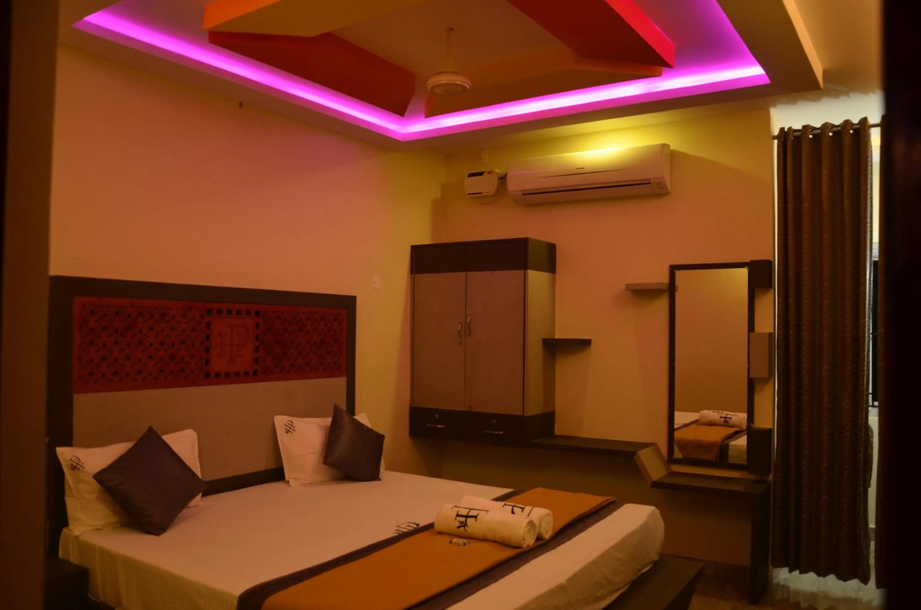 Bed in HOTEL PANCHAVARNAA