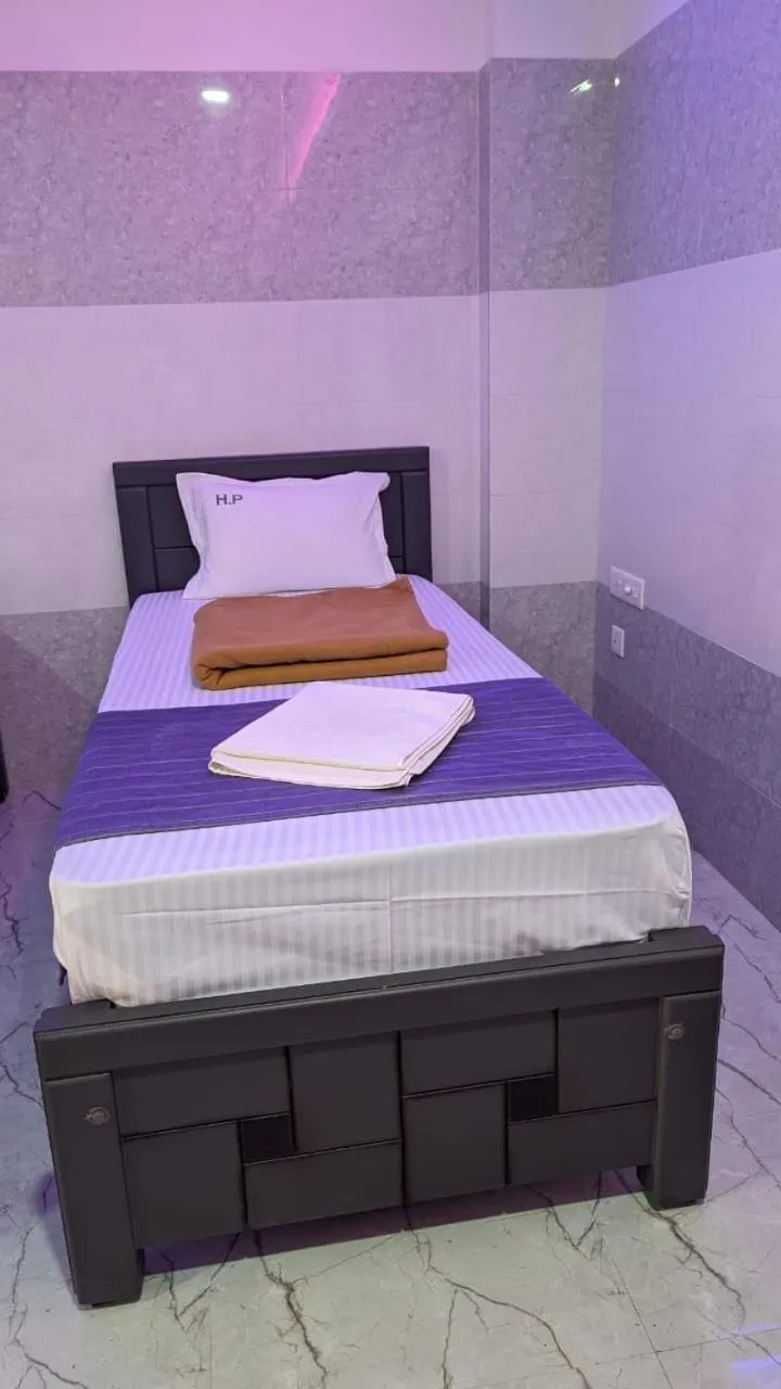 Bed in HOTEL PANCHAVARNAA