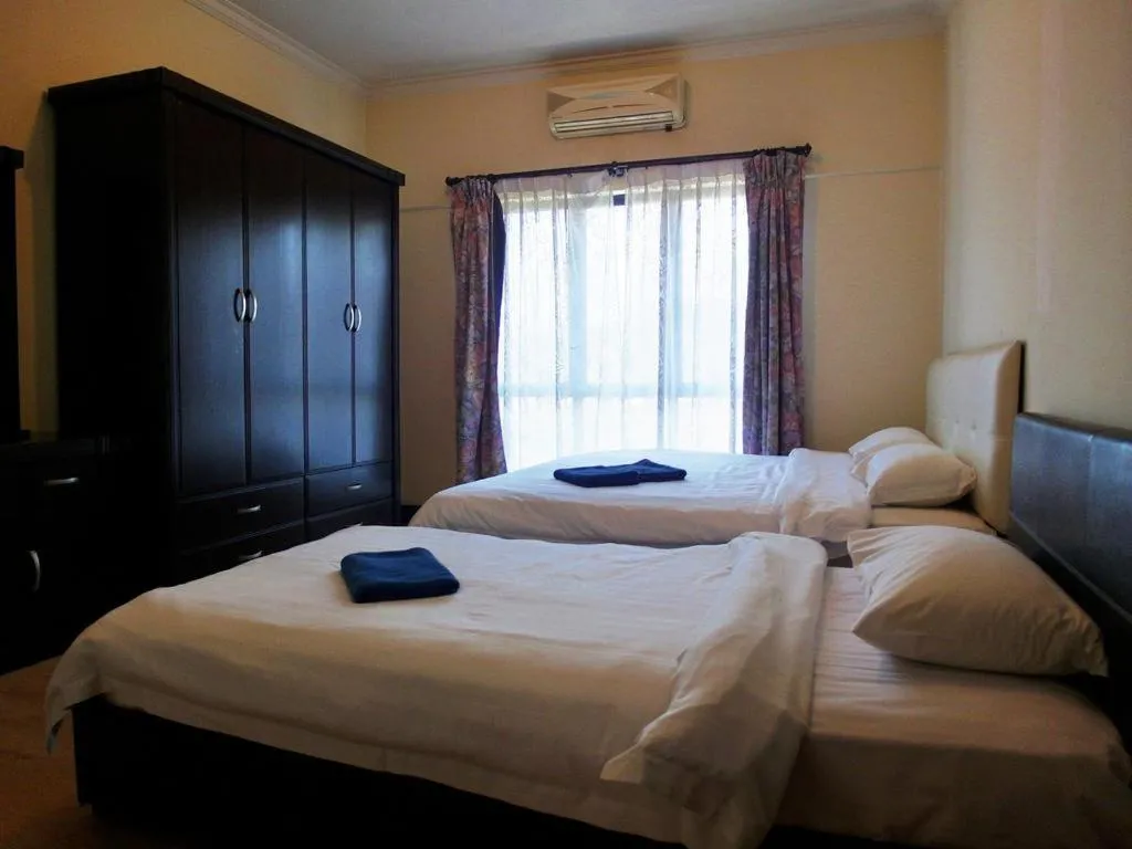 Bed in Marina Condominium Holiday Homestay