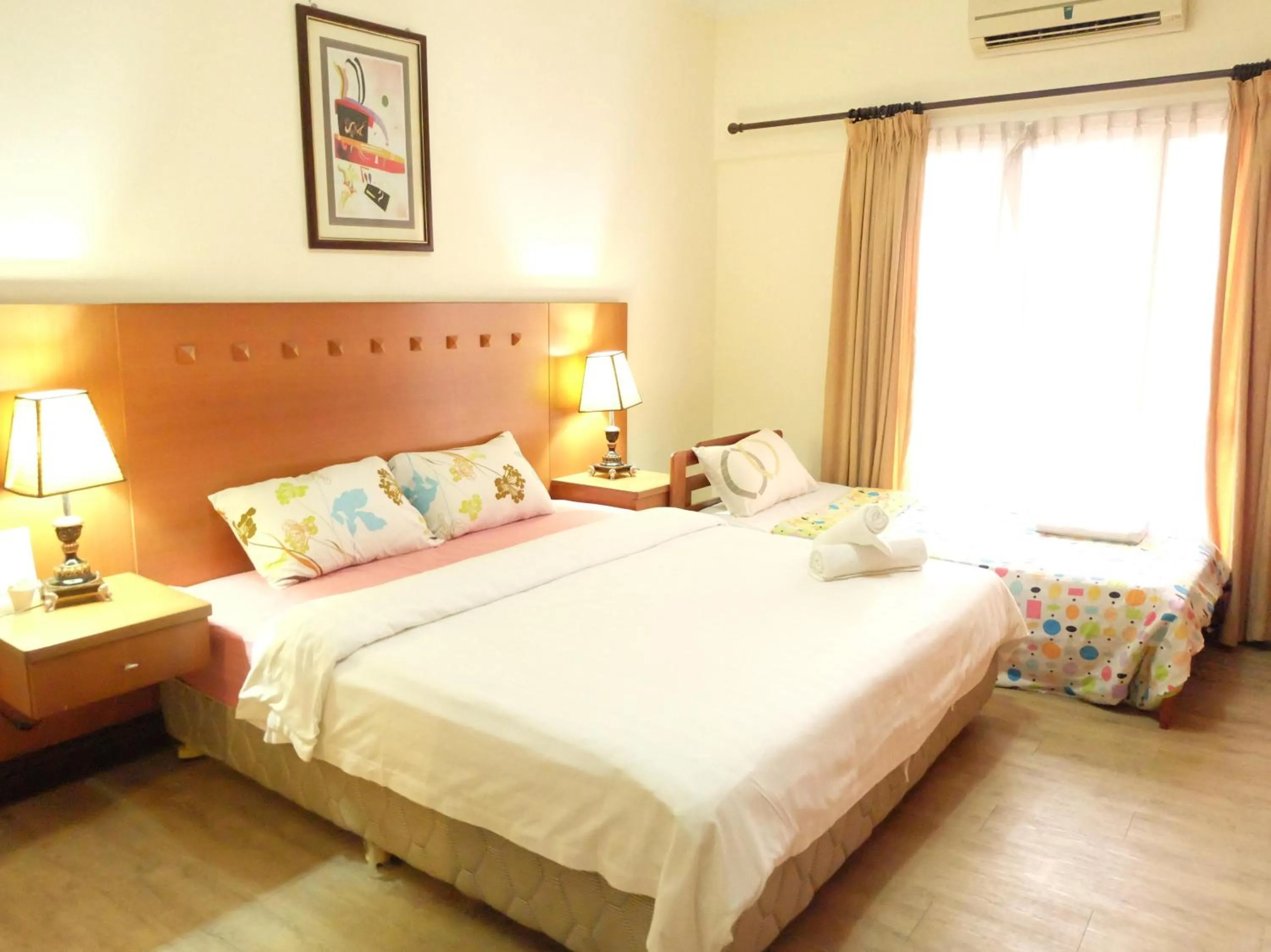 Bed in Marina Condominium Holiday Homestay