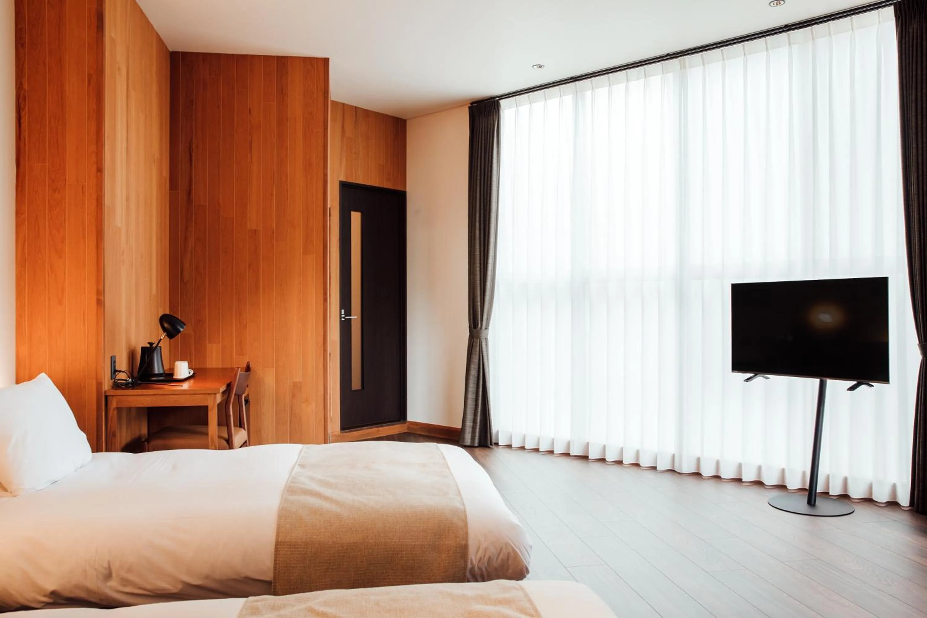 Bed in HOTEL KARUIZAWA CROSS