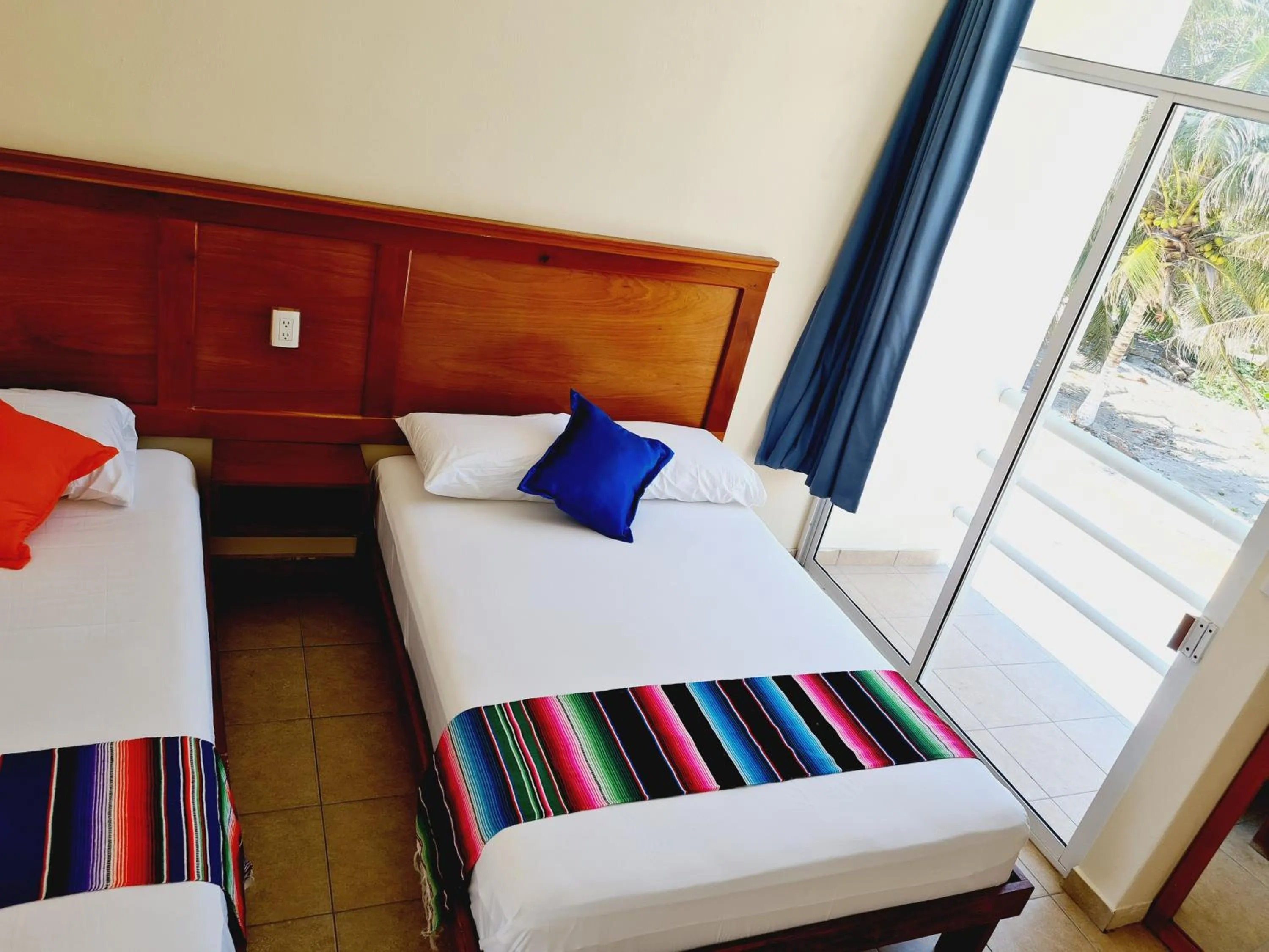 View (from property/room), Bed in Hotel Machos Mahahual