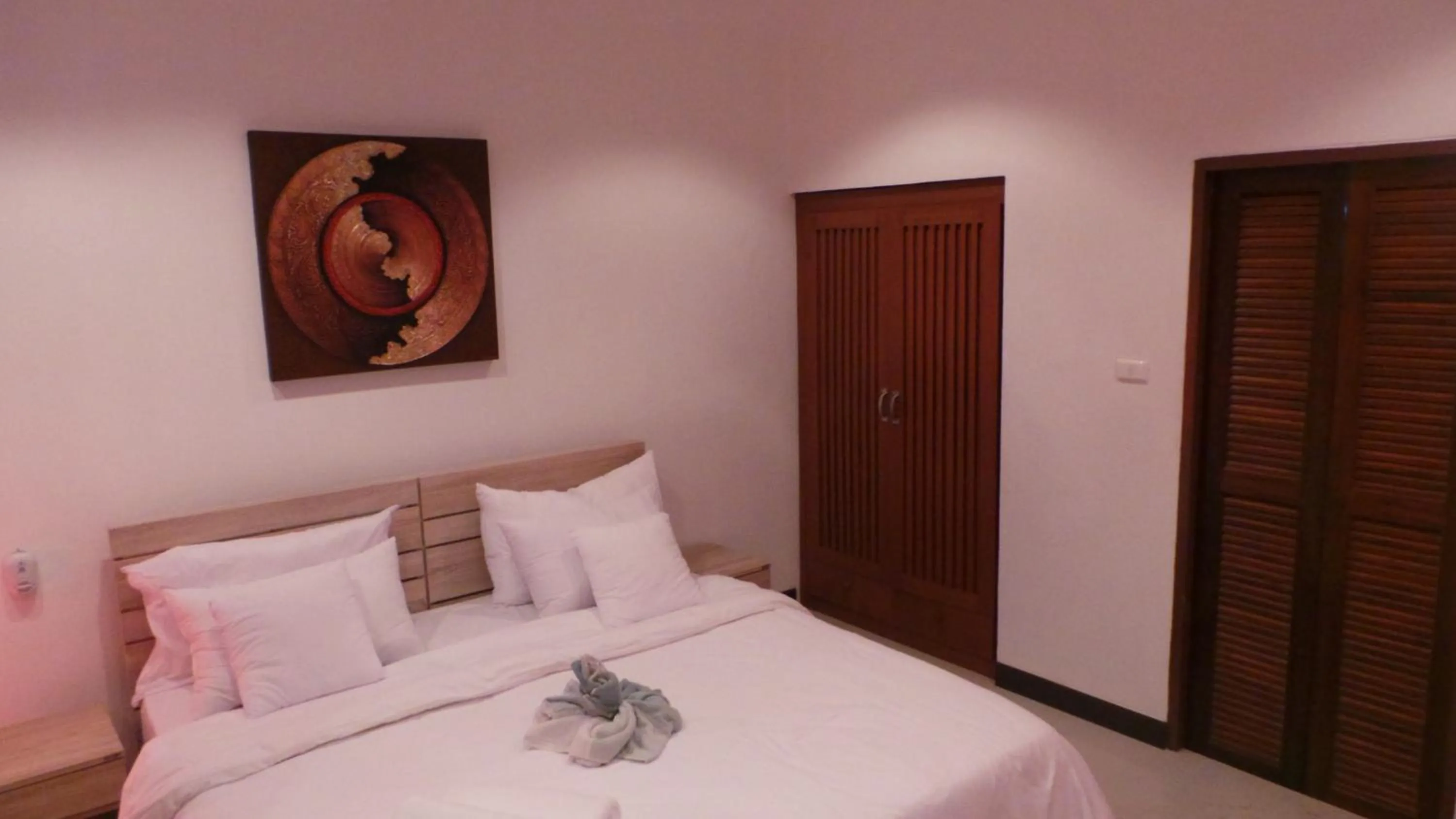 Bed in The Reef Resort