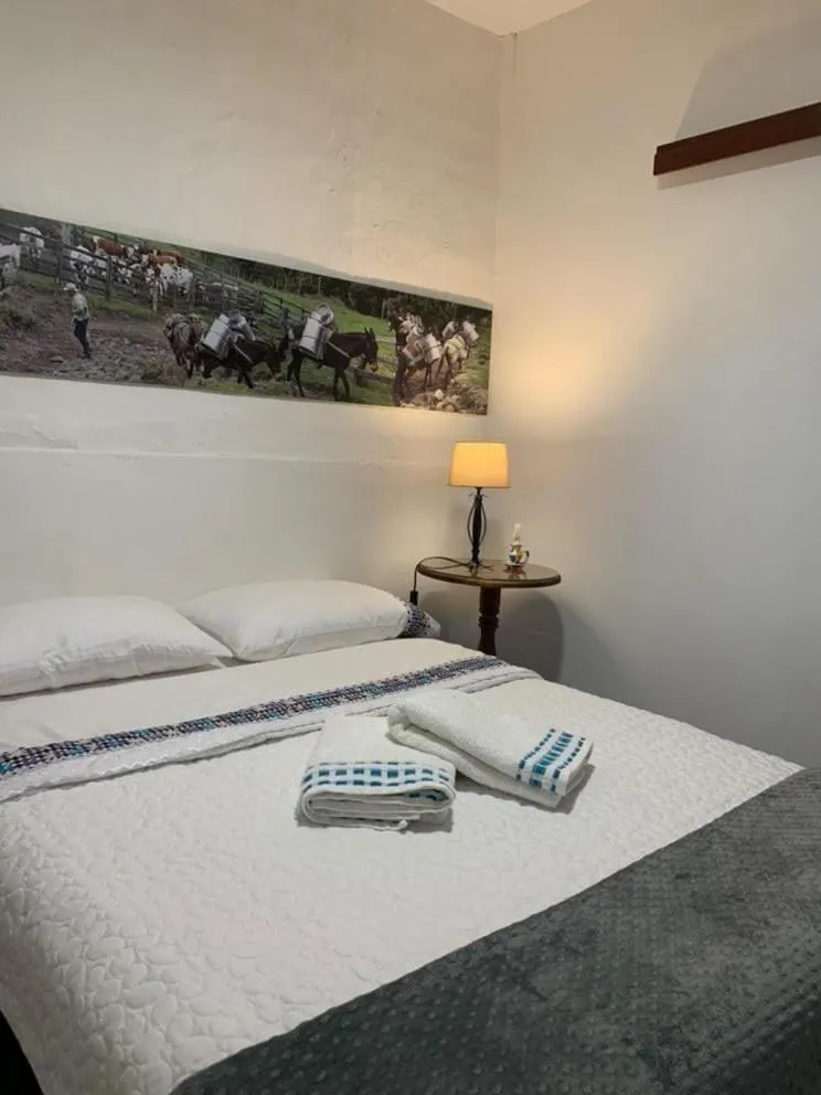 Bed in La Estancia Hotel Boutique