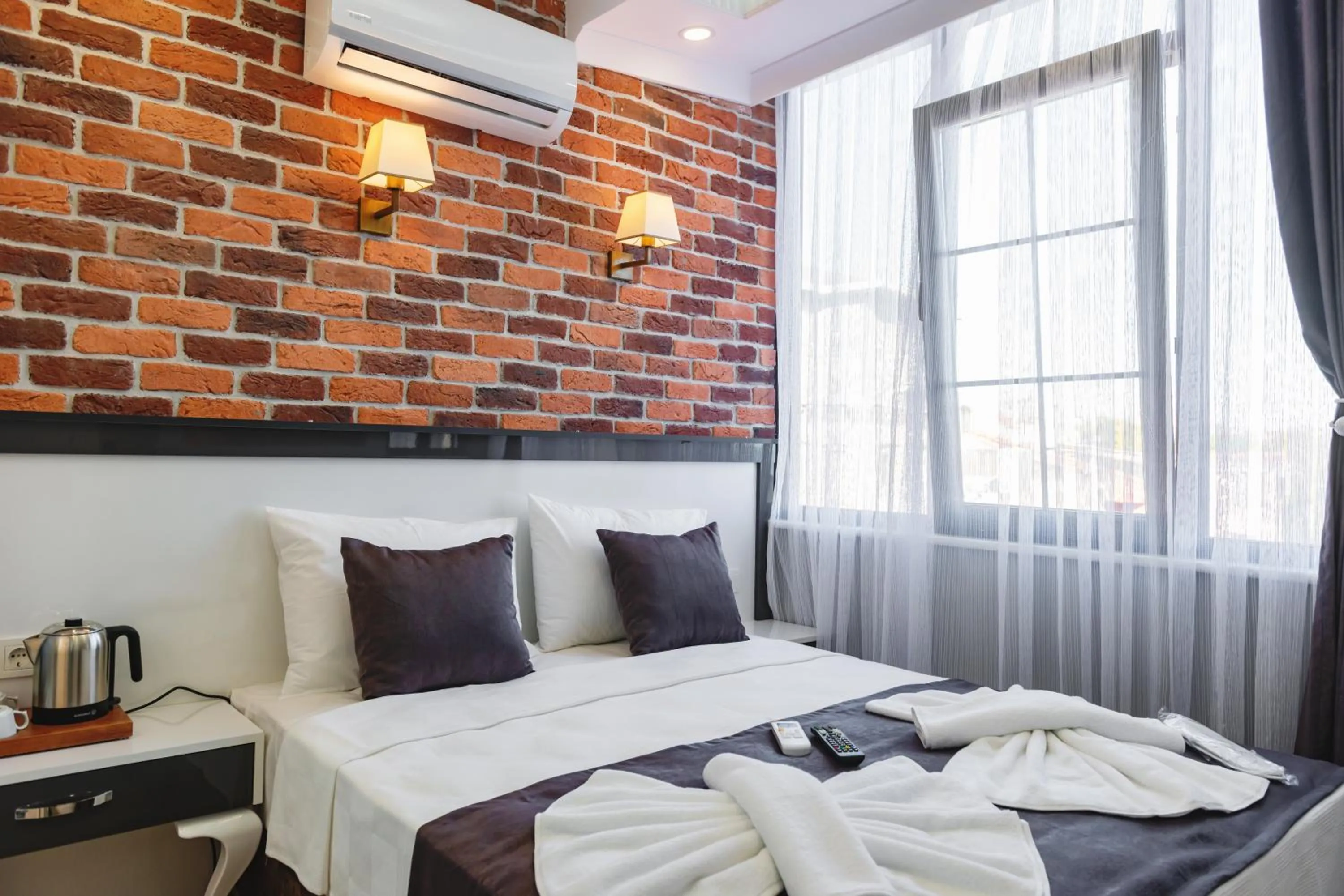 Bed in Gloria Suites Old City