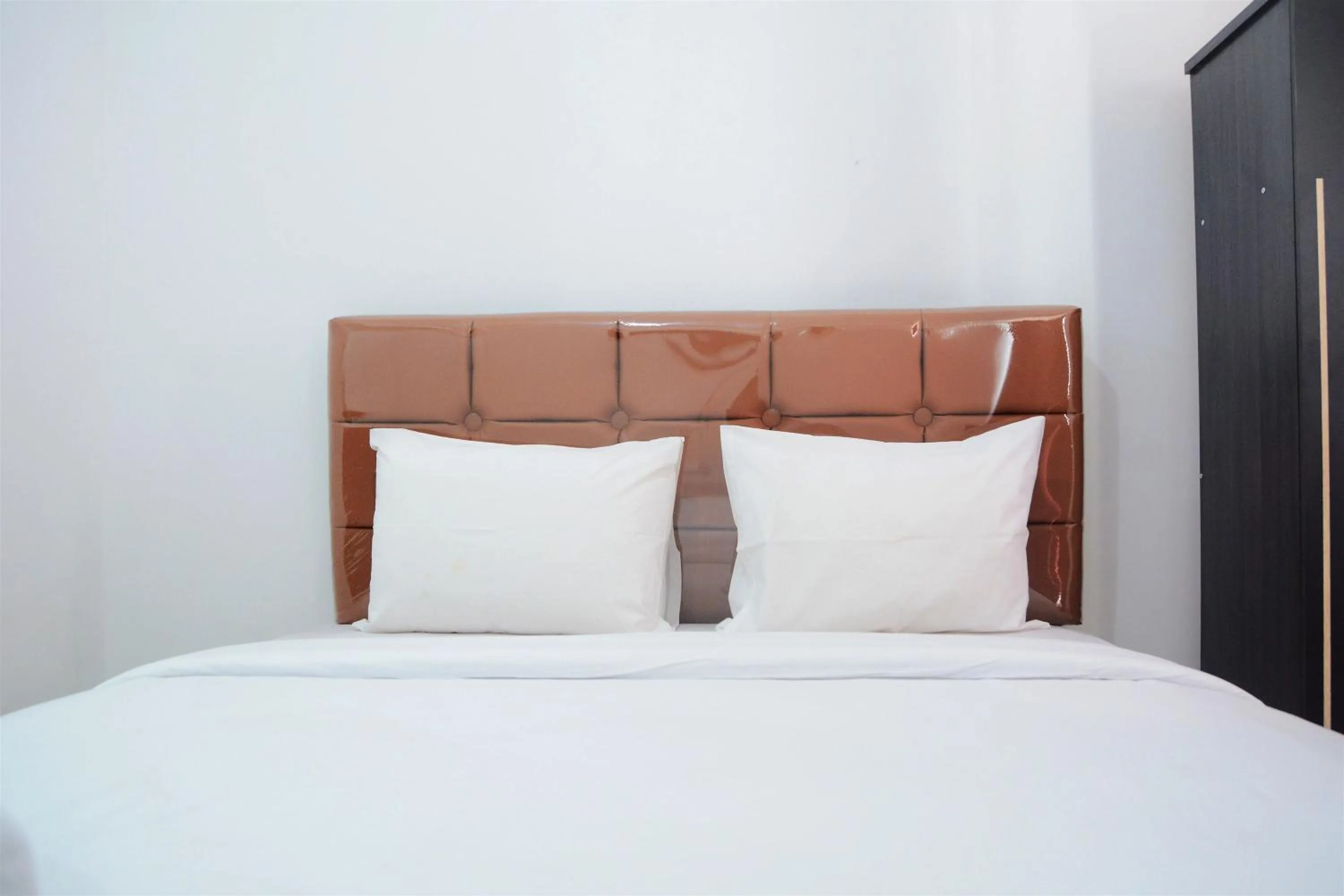 Bed in Comfy Studio Poris 88 Apartment By Travelio