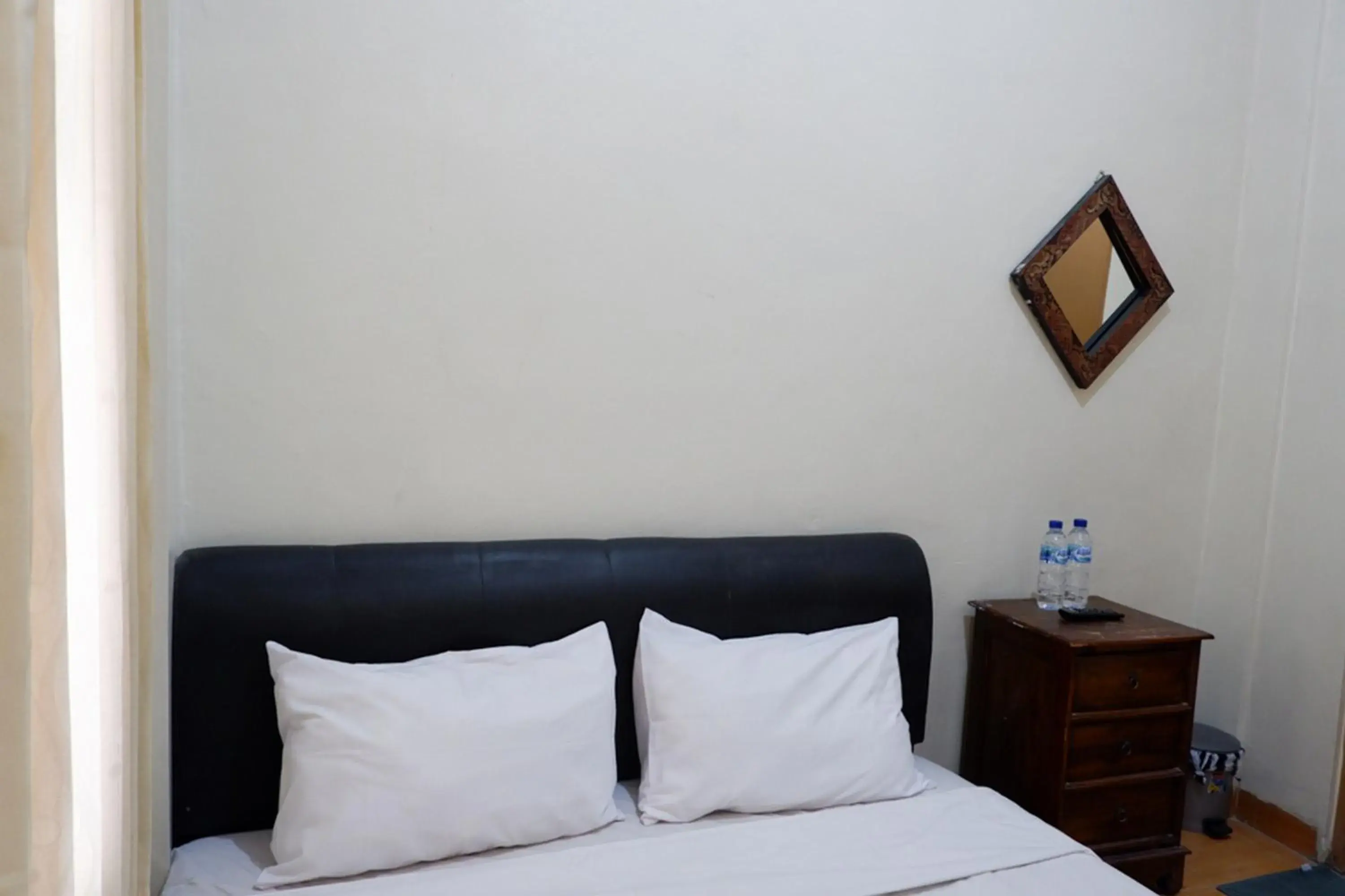 Bed in Khresna Guest House Malioboro Mitra RedDoorz Bed in Khresna Guest House Malioboro Mitra RedDoorz