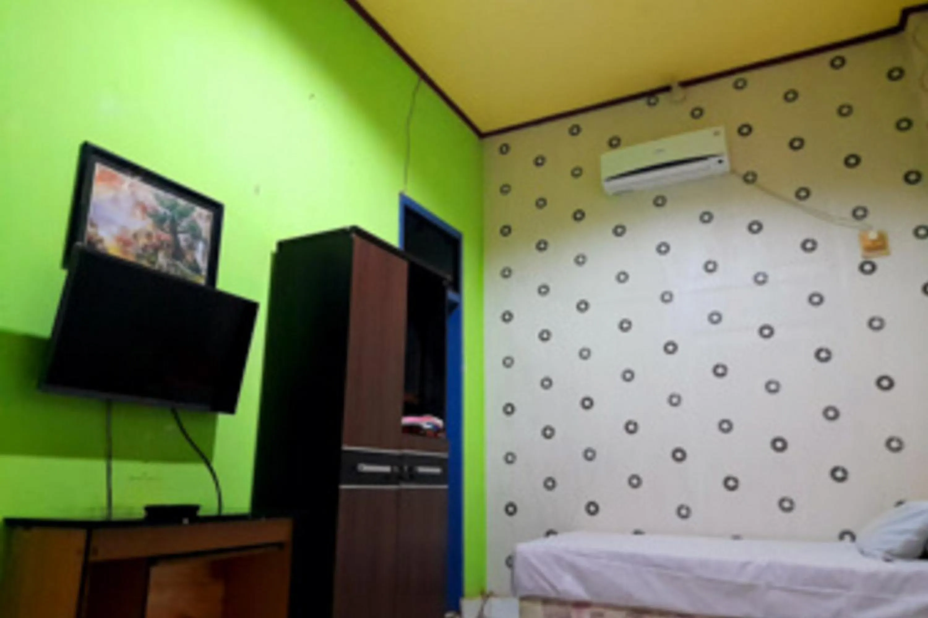 Bed in Hotel Rosichan Bau Bau Mitra RedDoorz