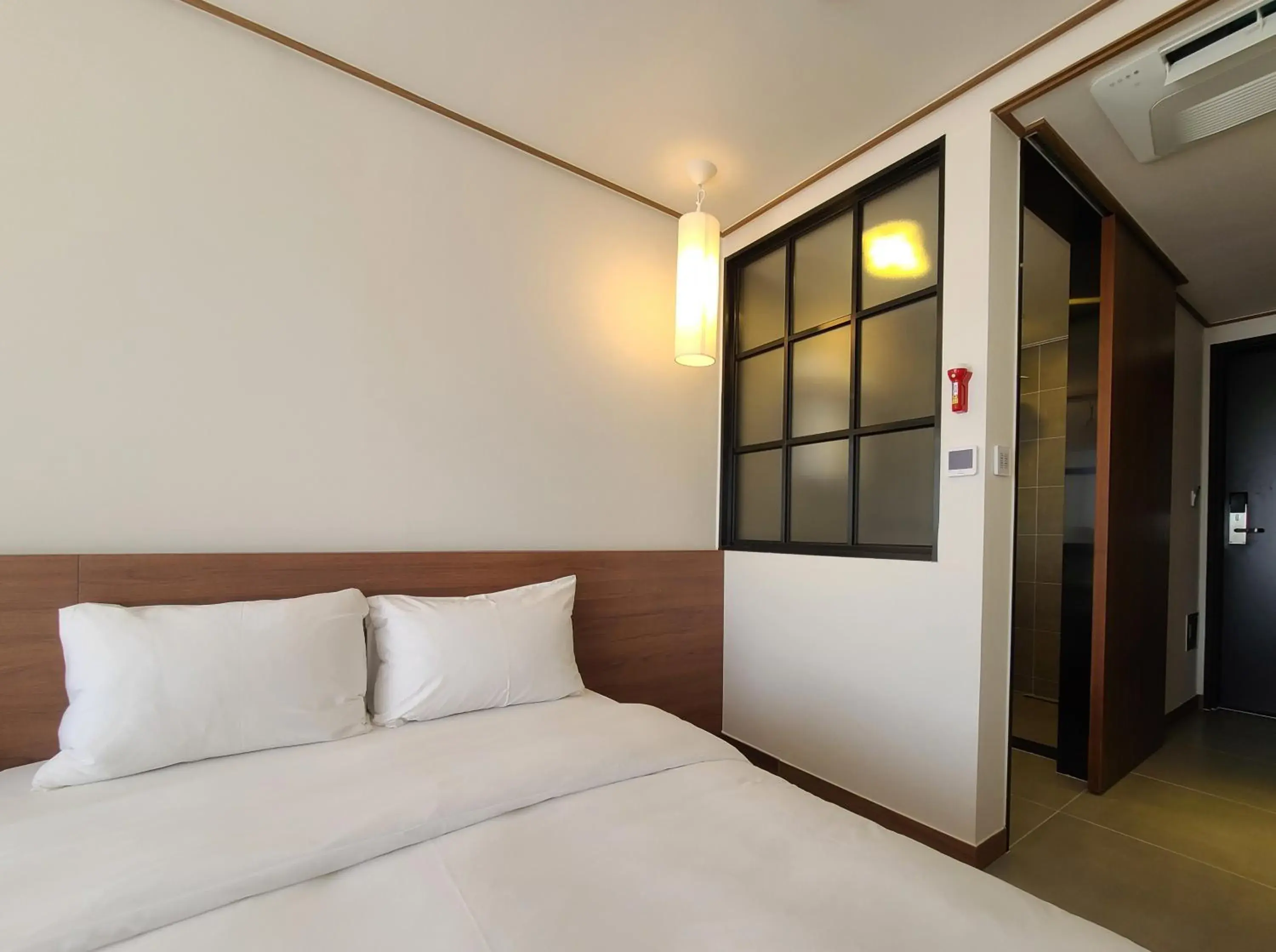 Bed in Tamara Jeju hotel Bed in Tamara Jeju hotel