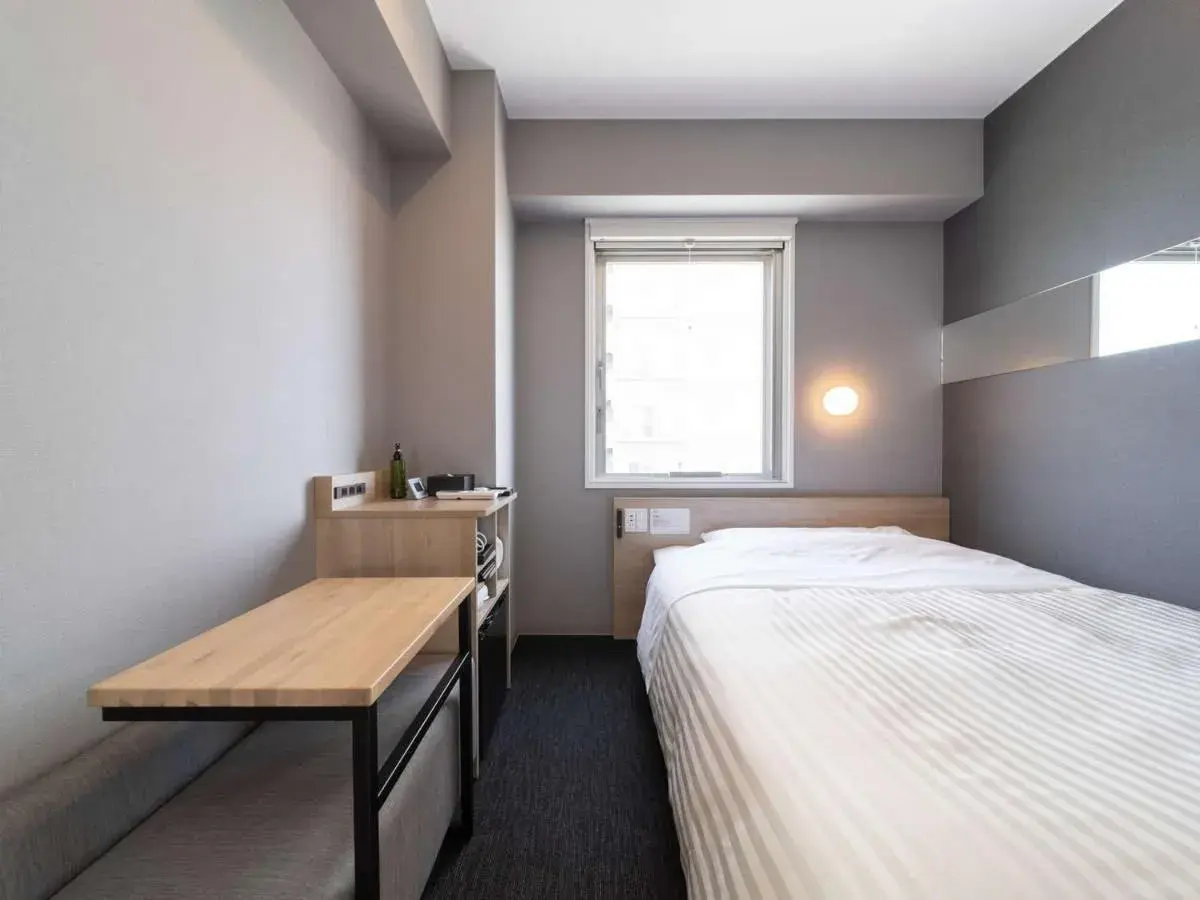 Bed in Super Hotel Tokyo Akabane Eki Minamiguchi Bed in Super Hotel Tokyo Akabane Eki Minamiguchi