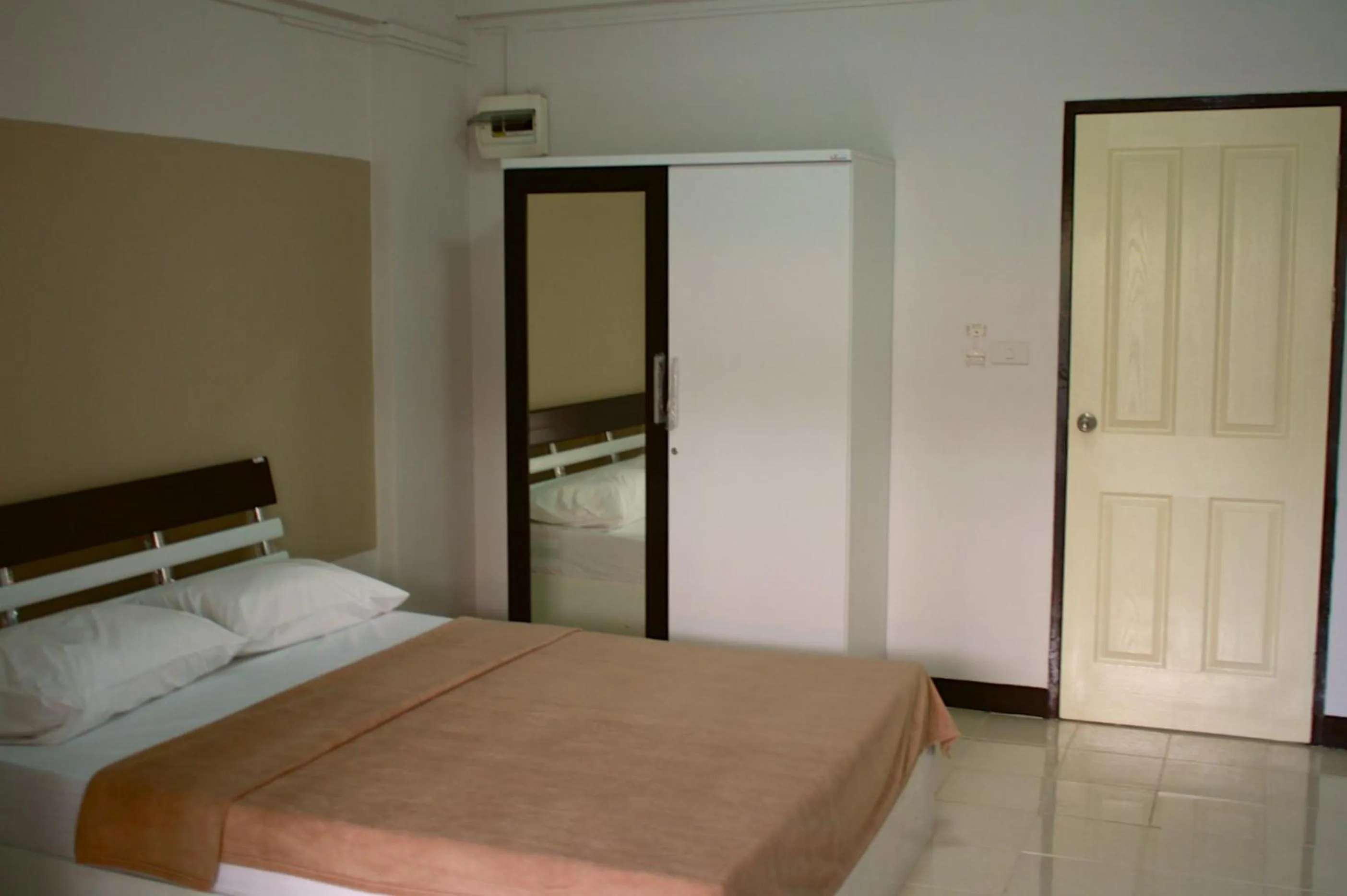 Bed in Baanbudsarin Apartment