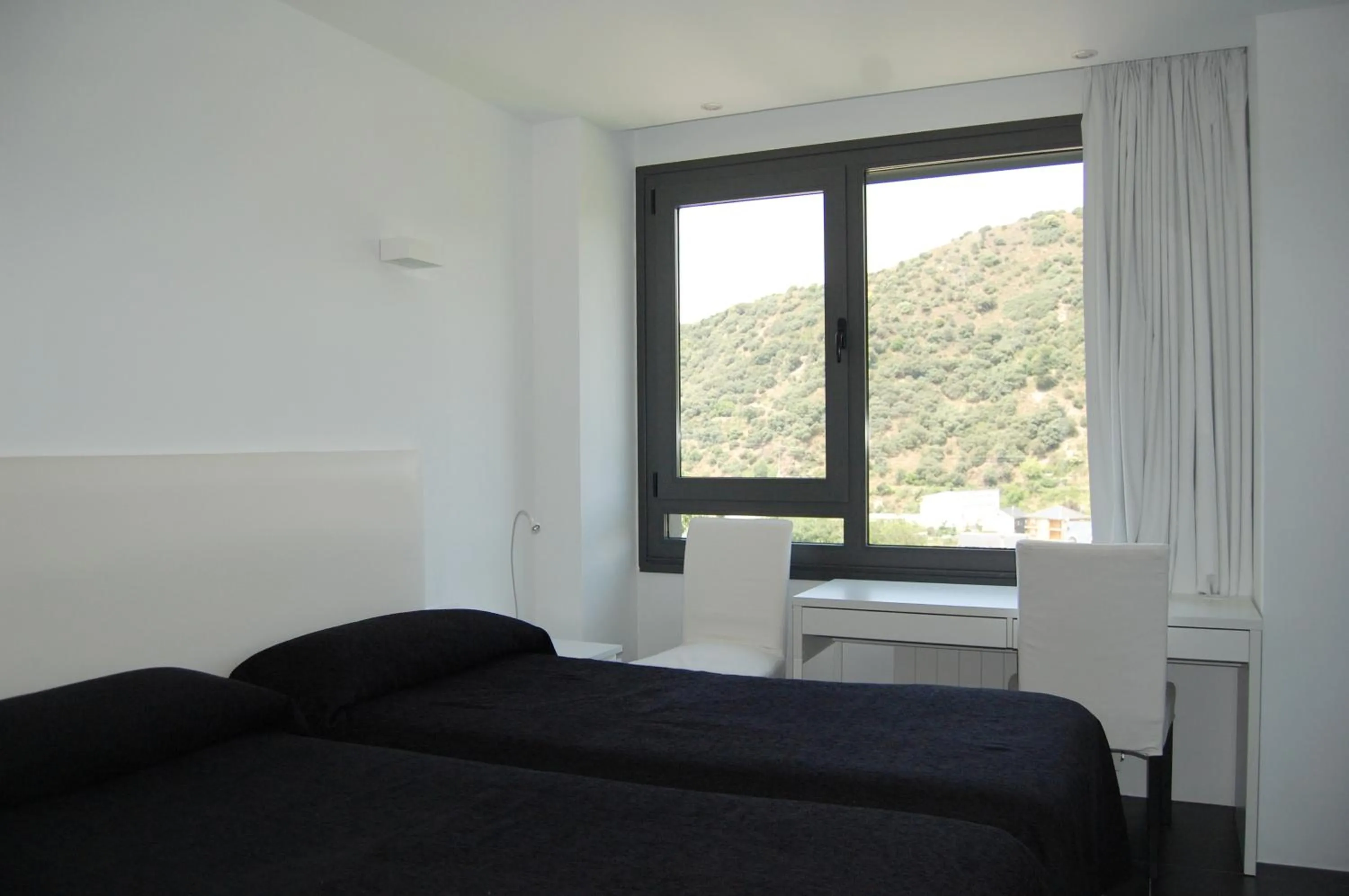 Photo of the whole room, Bed in Hostal Tres Campanas