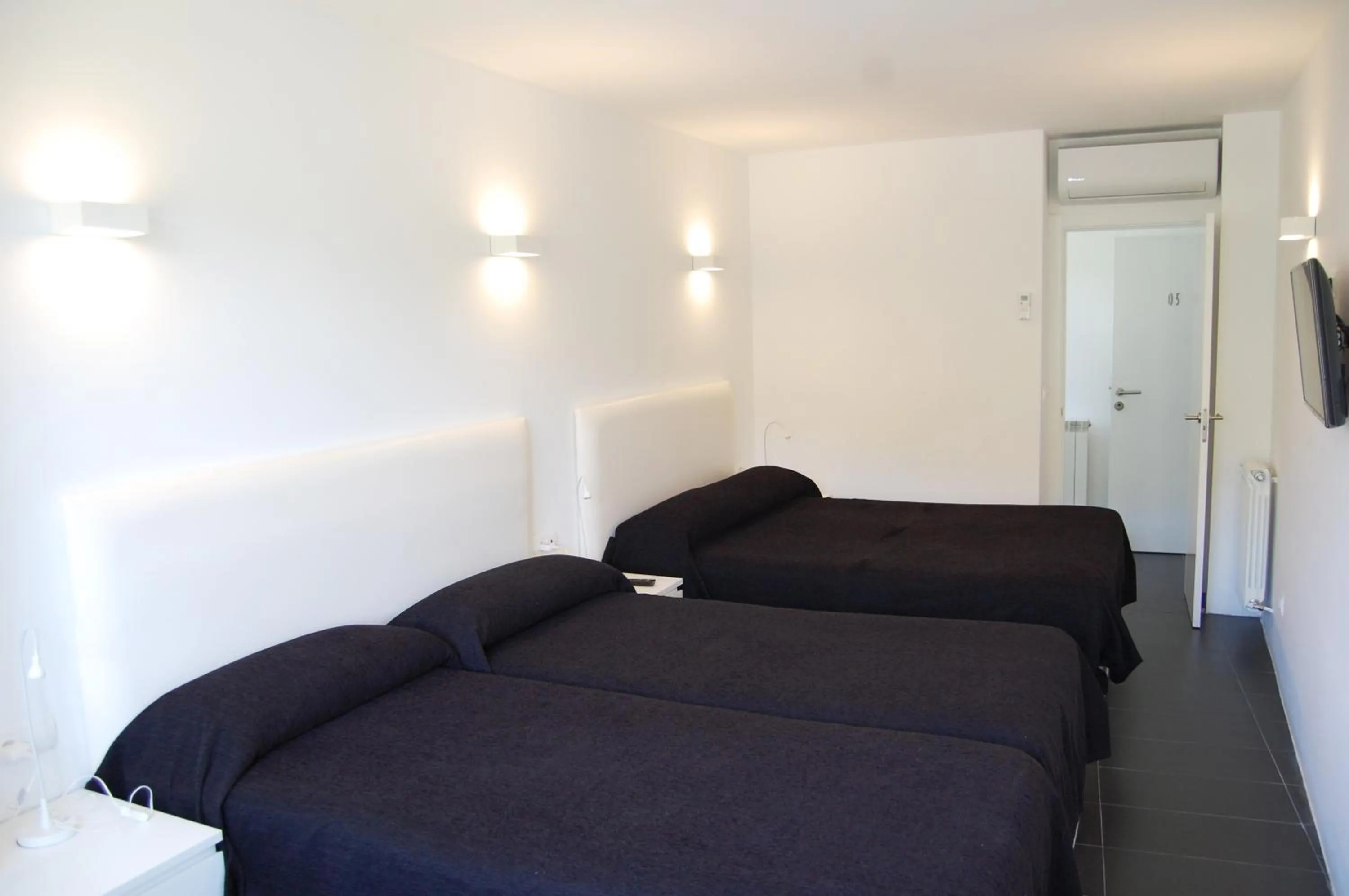 Bed in Hostal Tres Campanas