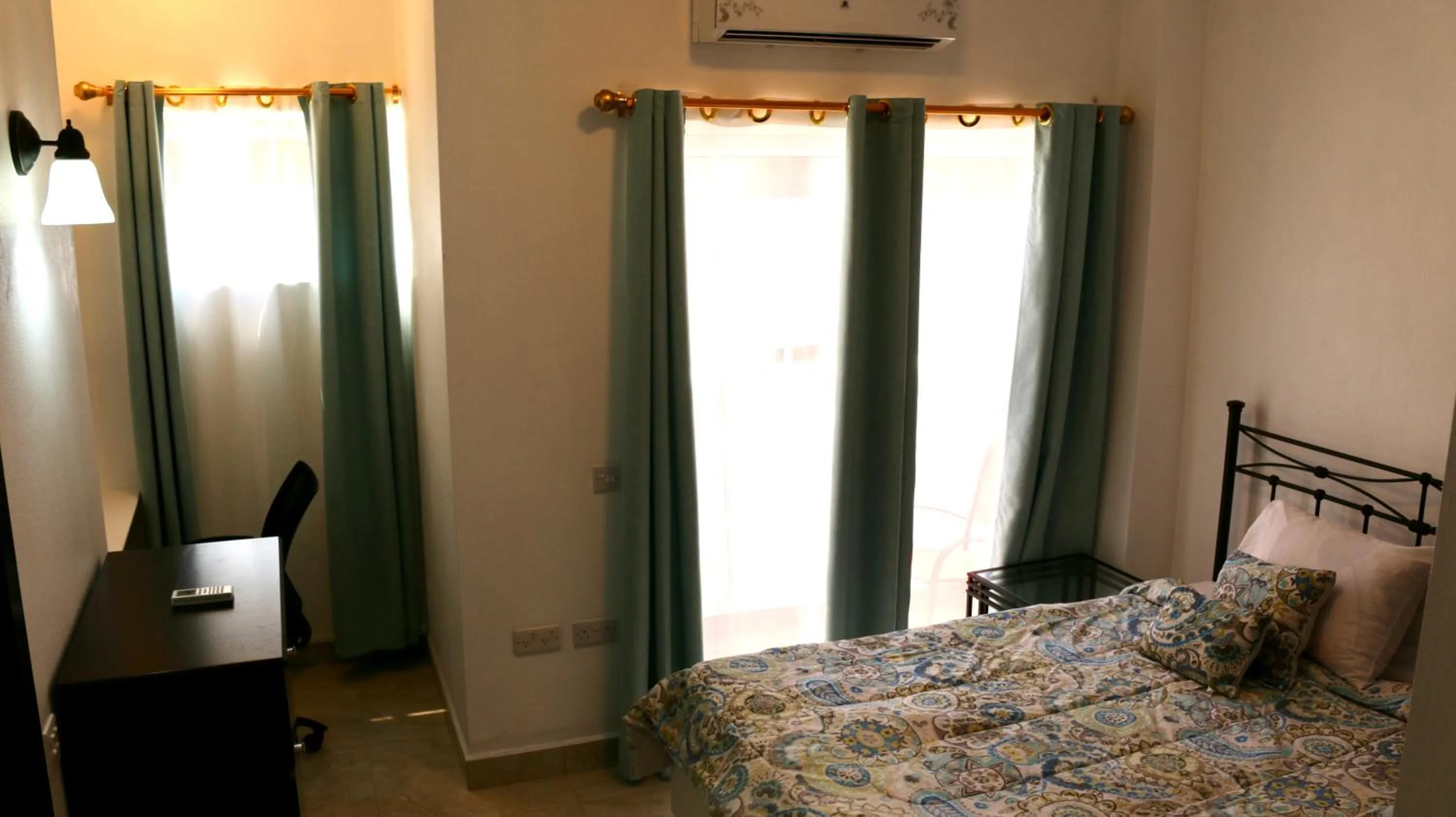 Bed in Blue Star Apartments & Hotel