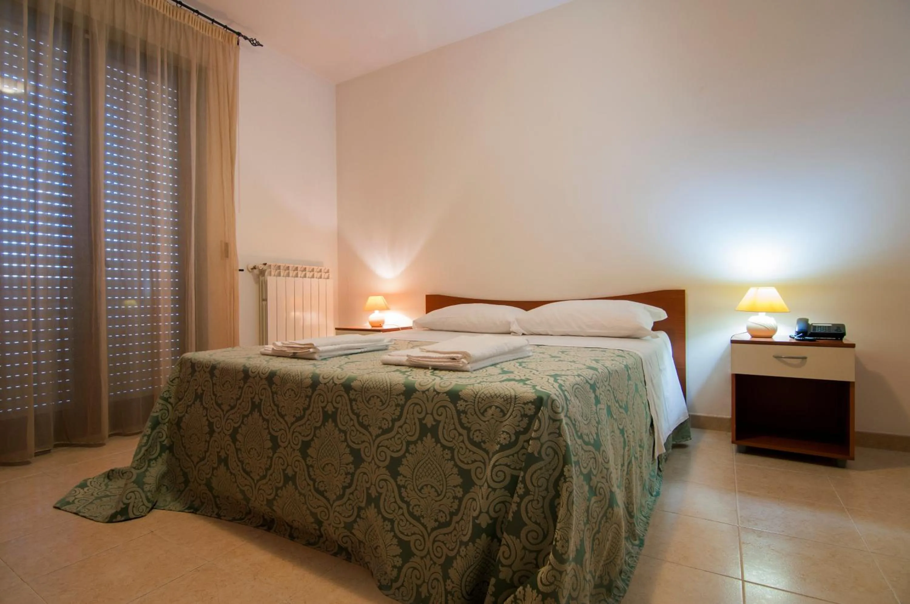 Bed in Ciao Hotel & Residence - Apartments