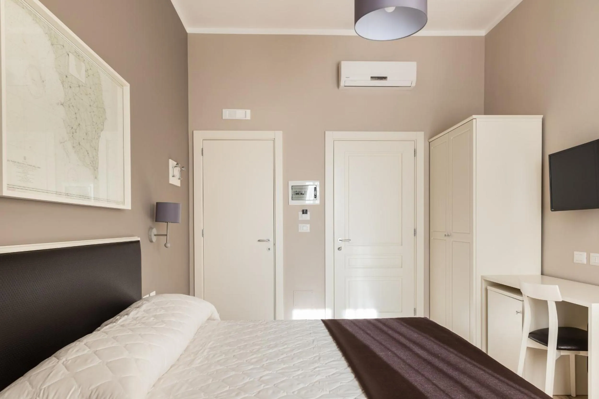 Bed in Faro Bianco Gallipoli Dependance