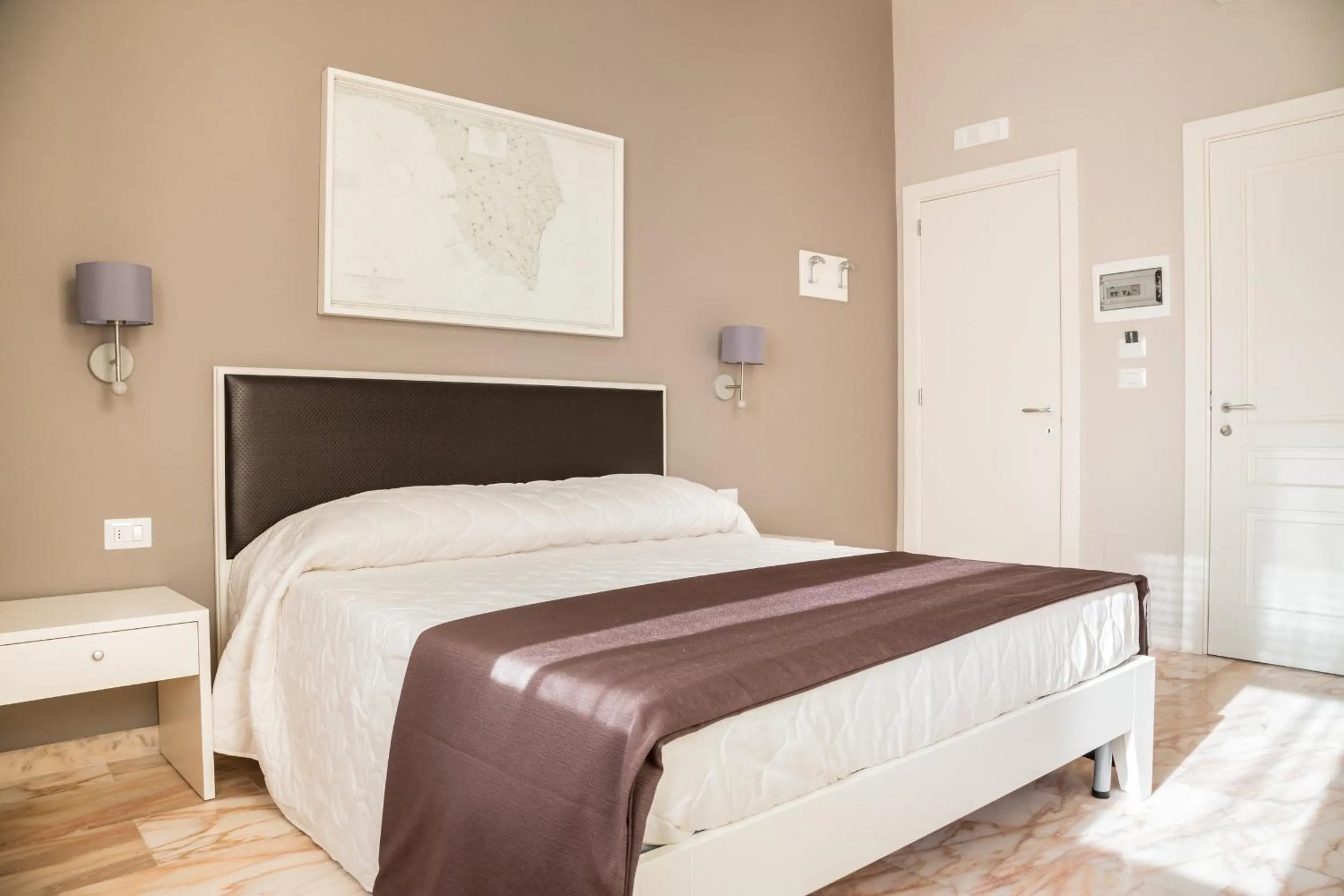 Bed in Faro Bianco Gallipoli Dependance