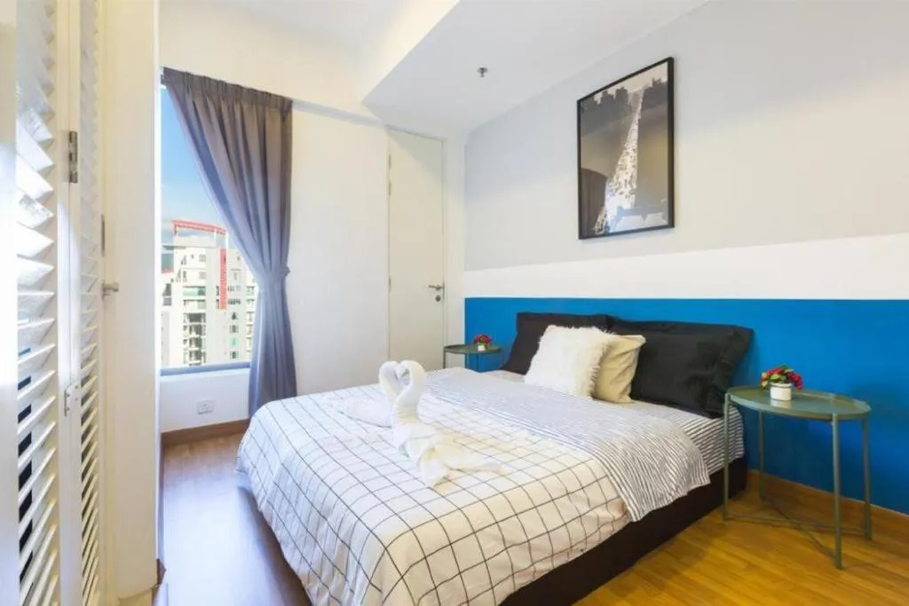 Bed in Georgetown Tropicana 218 Apartment