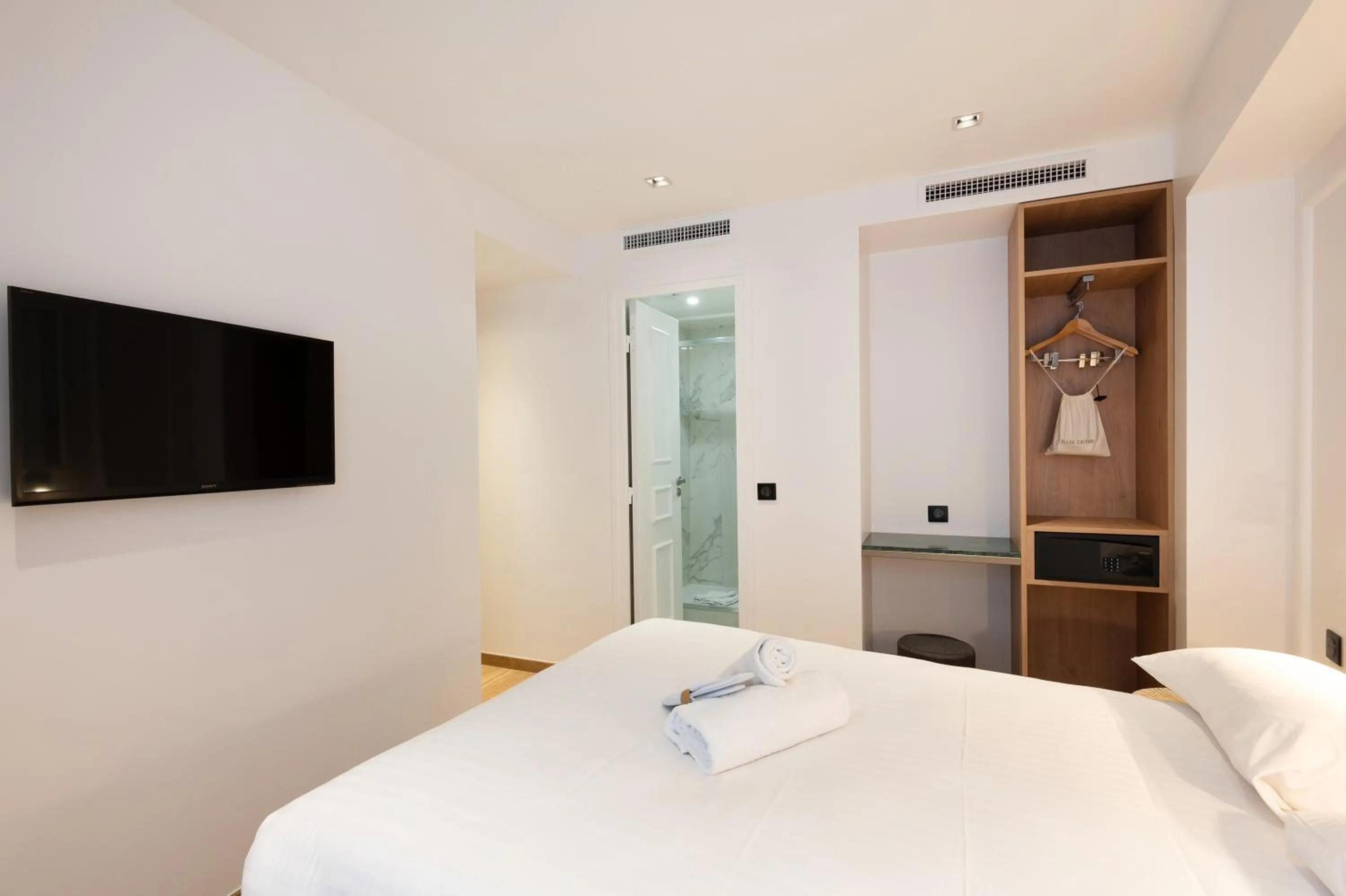 Photo of the whole room, Bed in HOTEL AU COEUR DE REPUBLIQUE