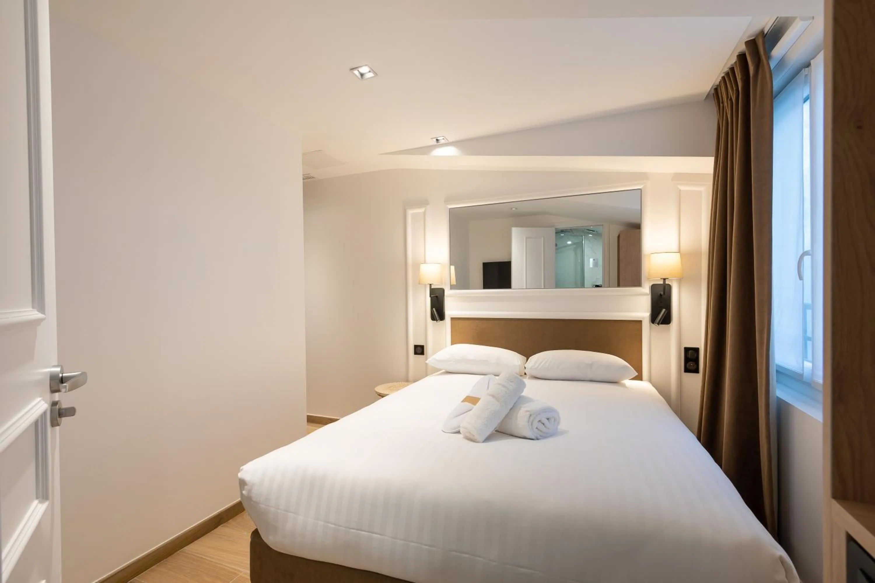 Photo of the whole room, Bed in HOTEL AU COEUR DE REPUBLIQUE