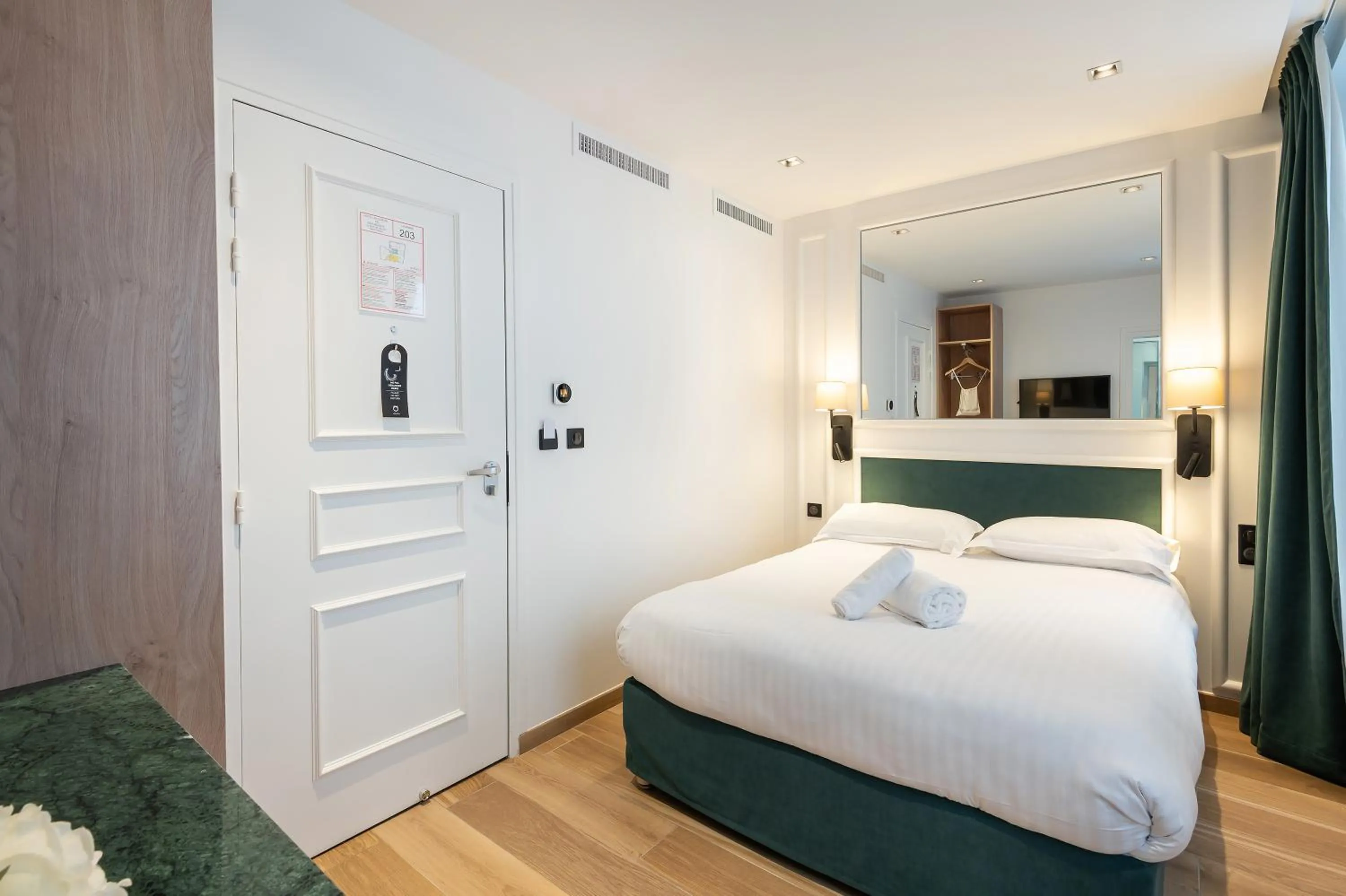 Bed in HOTEL AU COEUR DE REPUBLIQUE