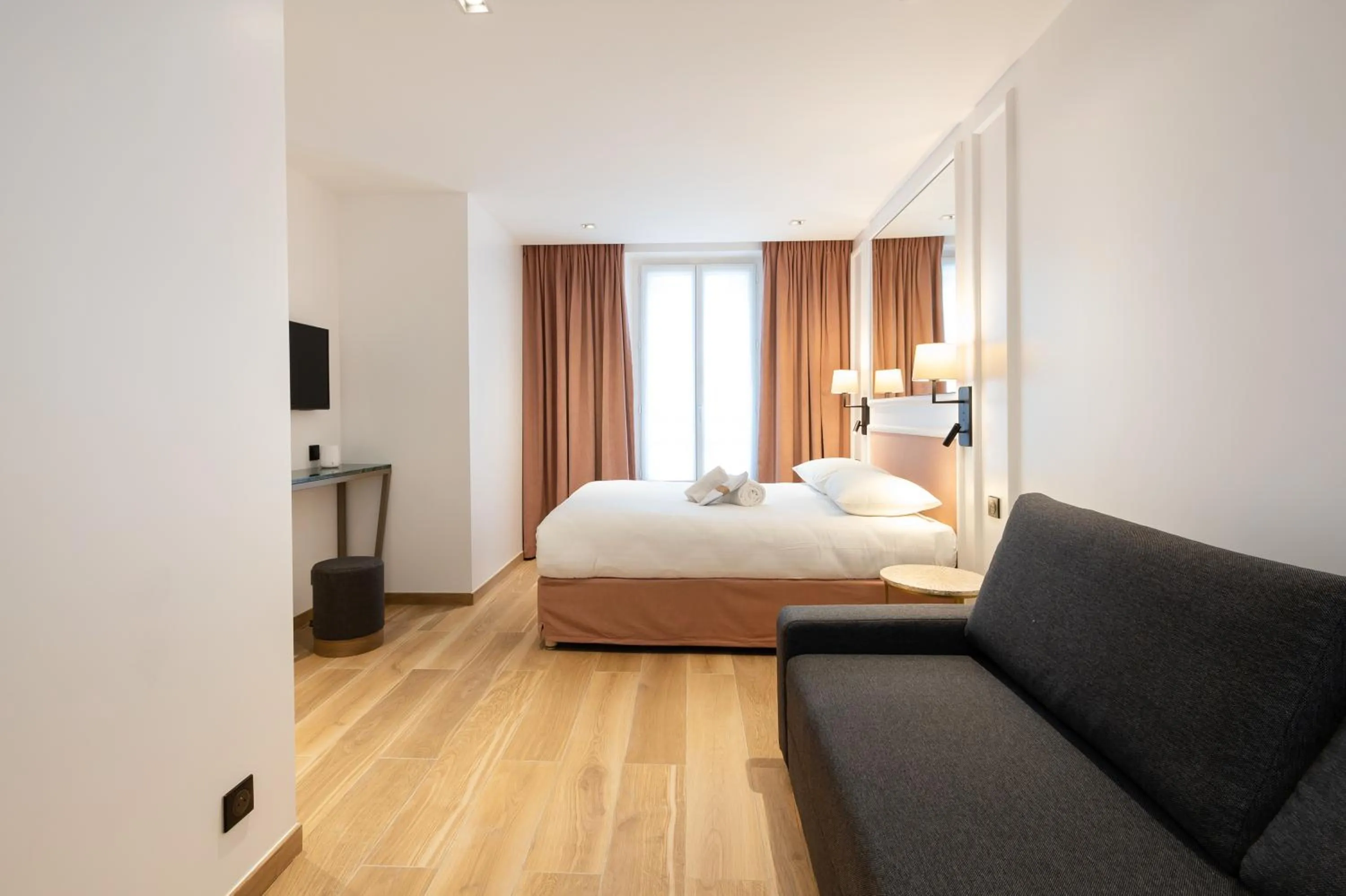 Photo of the whole room, Bed in HOTEL AU COEUR DE REPUBLIQUE