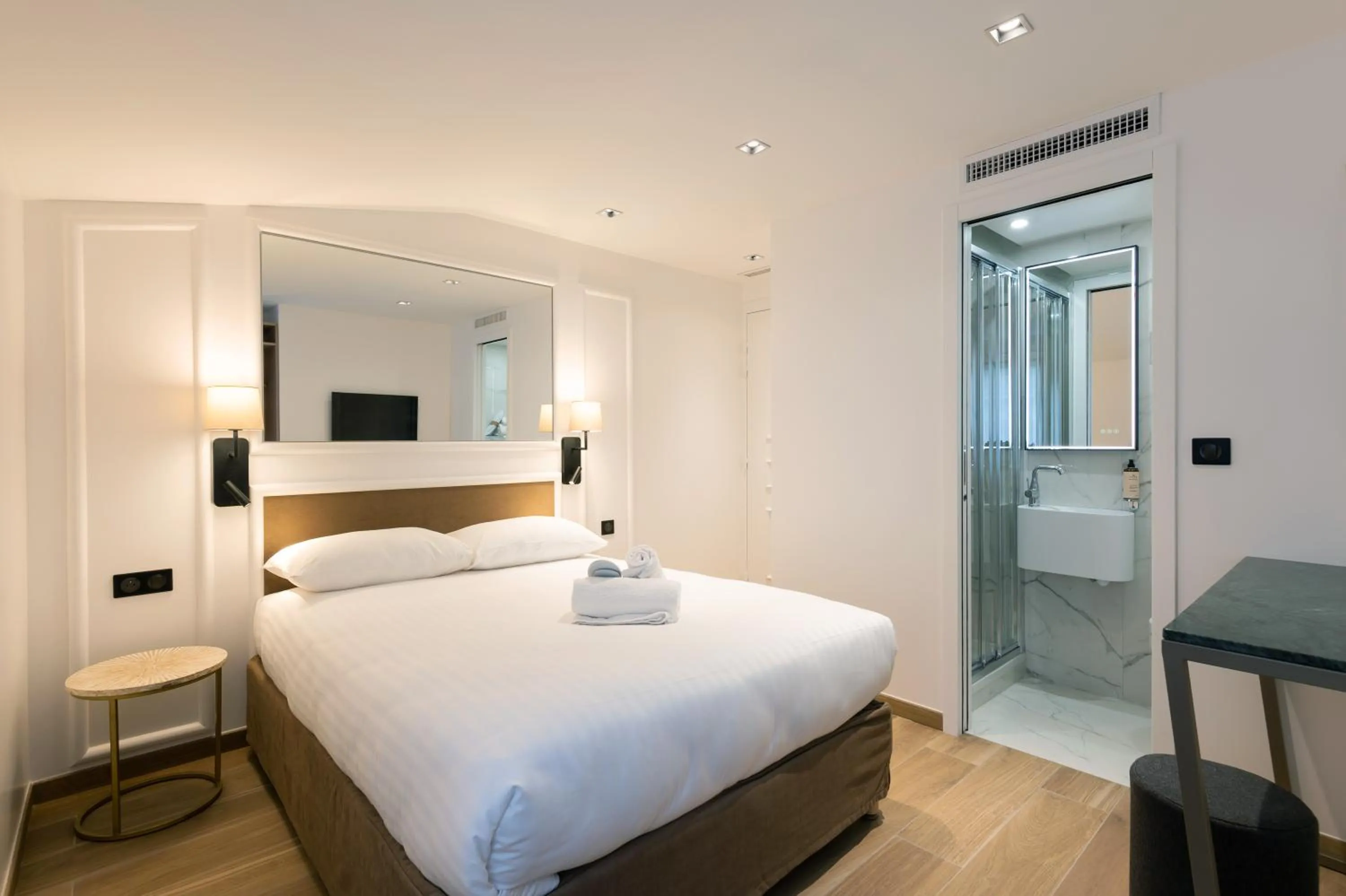 Photo of the whole room, Bed in HOTEL AU COEUR DE REPUBLIQUE