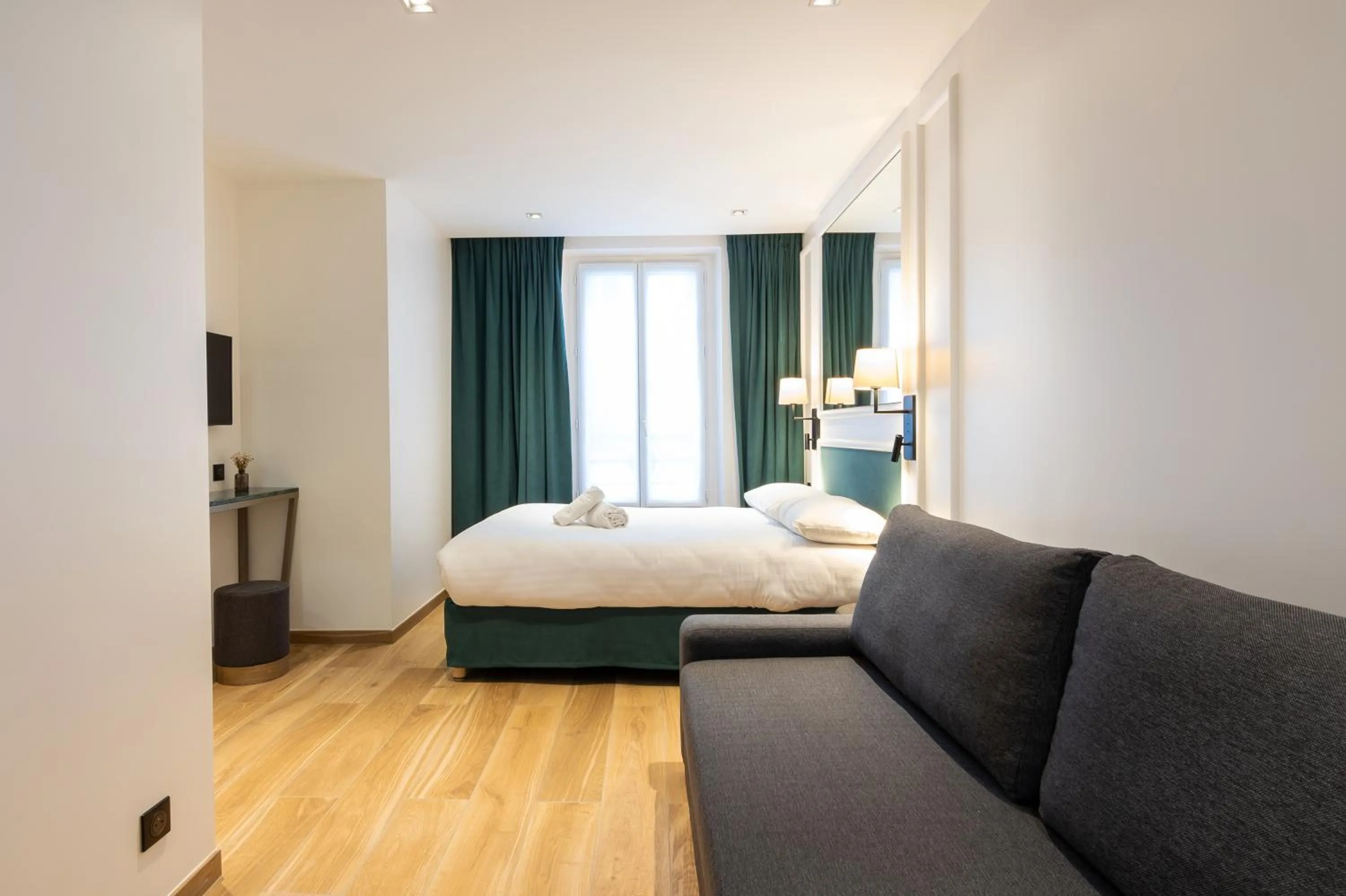 Bed in HOTEL AU COEUR DE REPUBLIQUE