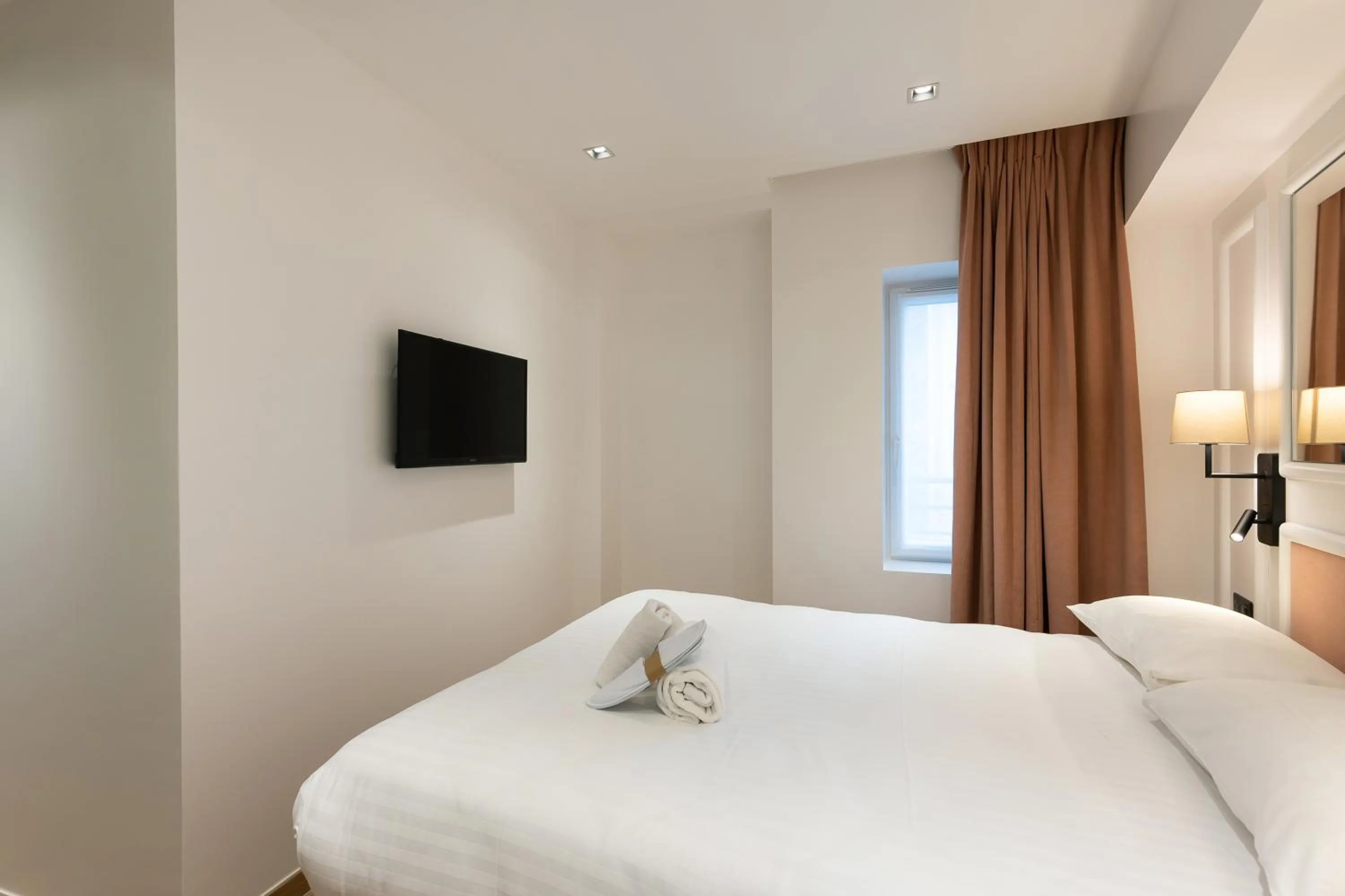 Photo of the whole room, Bed in HOTEL AU COEUR DE REPUBLIQUE