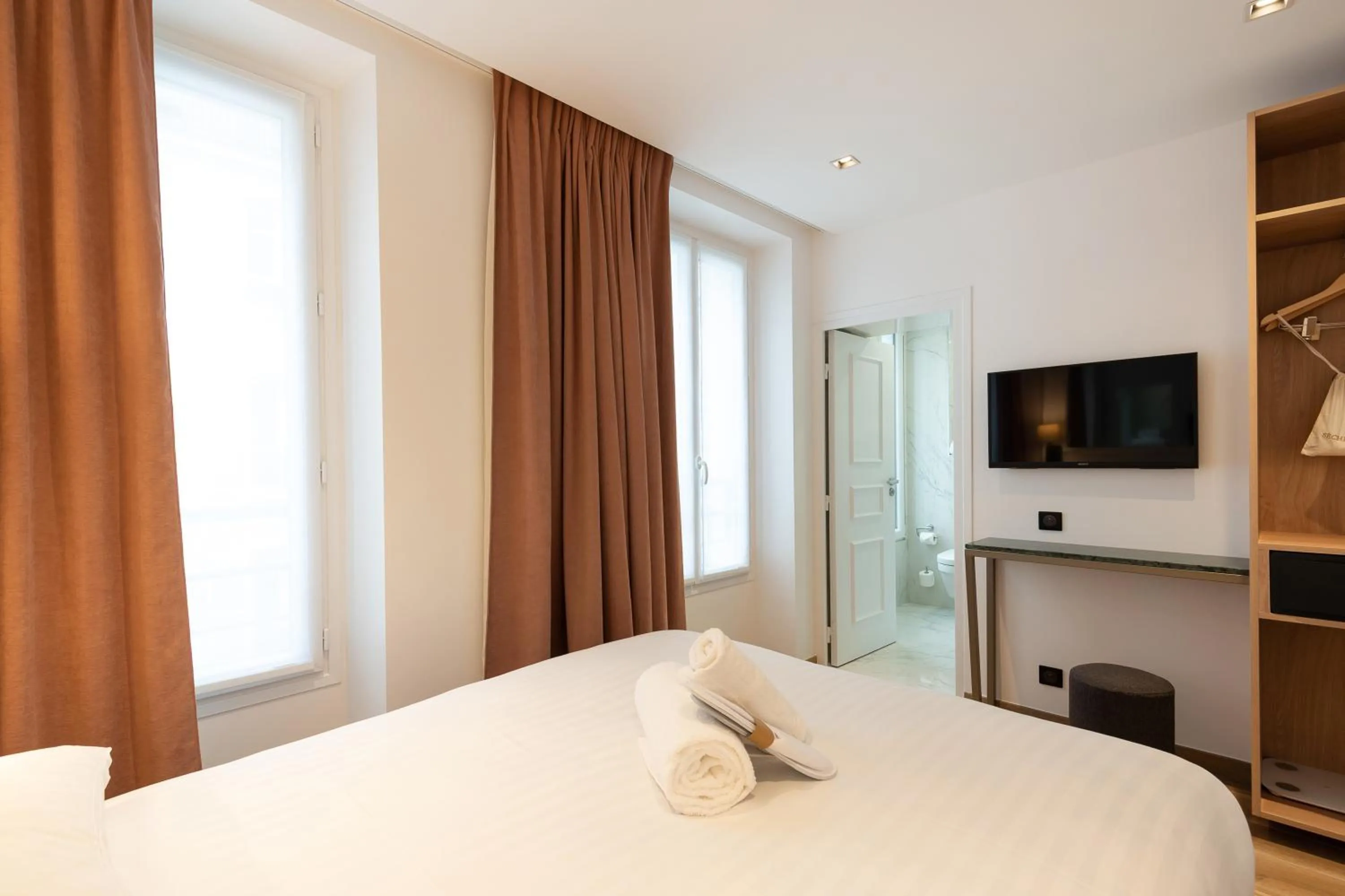 Photo of the whole room, Bed in HOTEL AU COEUR DE REPUBLIQUE