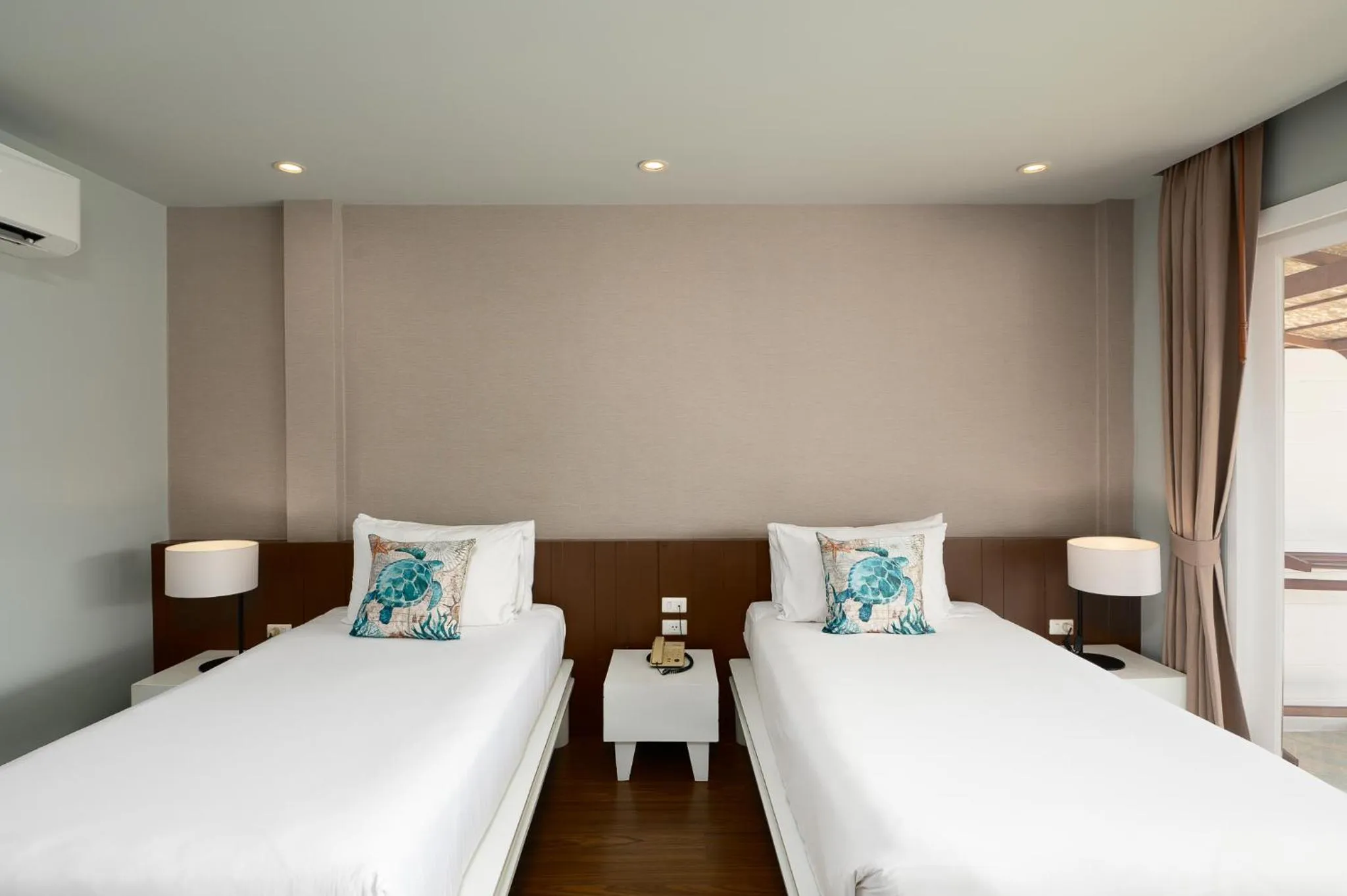 Bed in Arinara Beach Resort Phuket - SHA Extra Plus