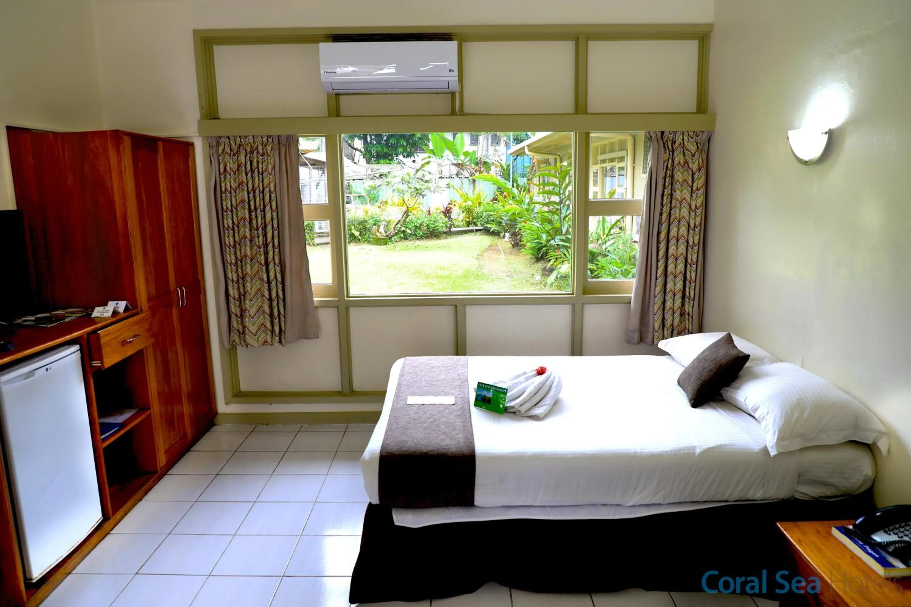 Bed in Huon Gulf Hotel