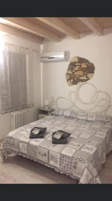 Bed in NICOLE DONEY LOCAZIONE TURISTICA