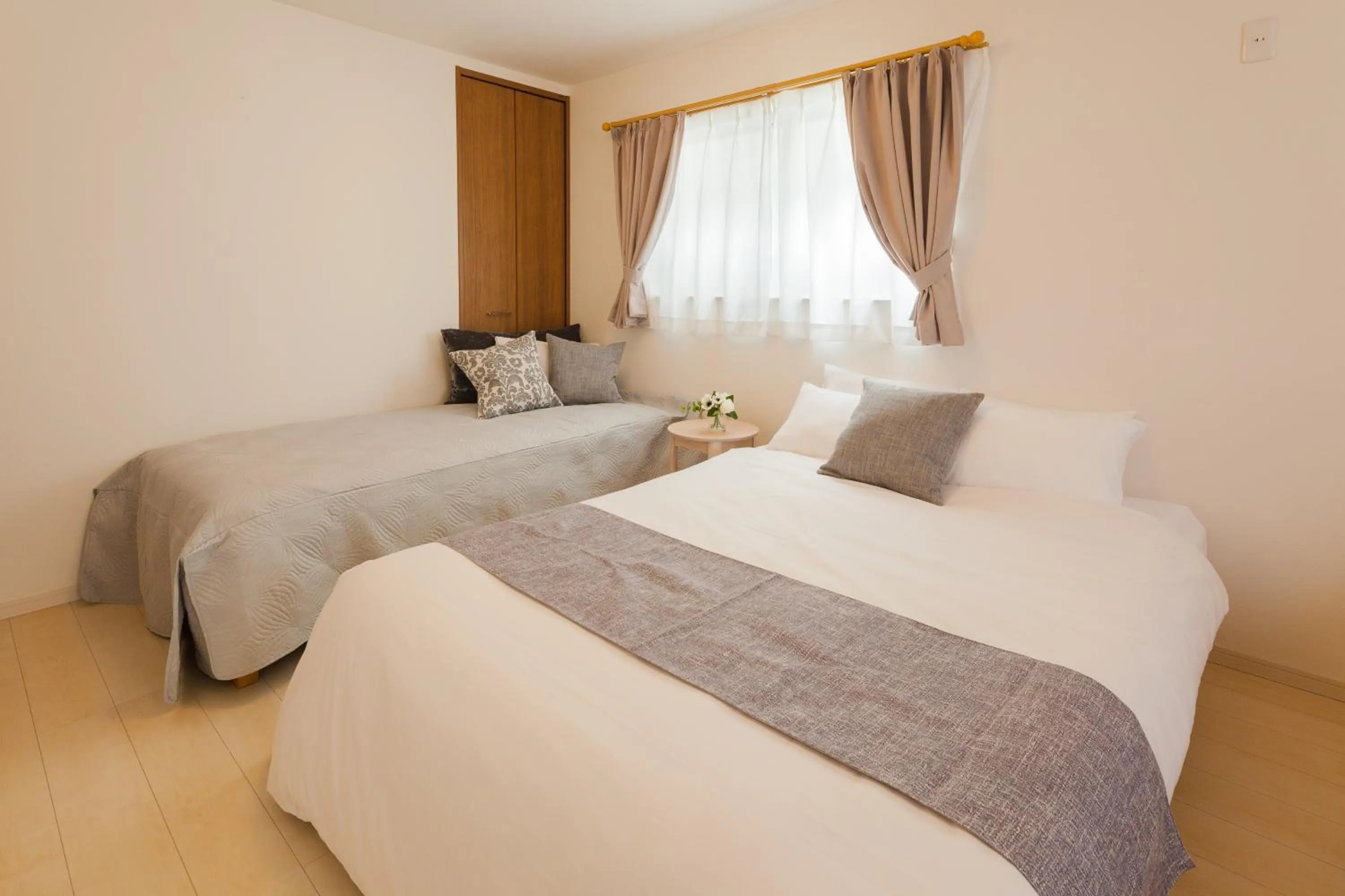 Bed in Prestige Suites Osaka Kishinosato-Tamade