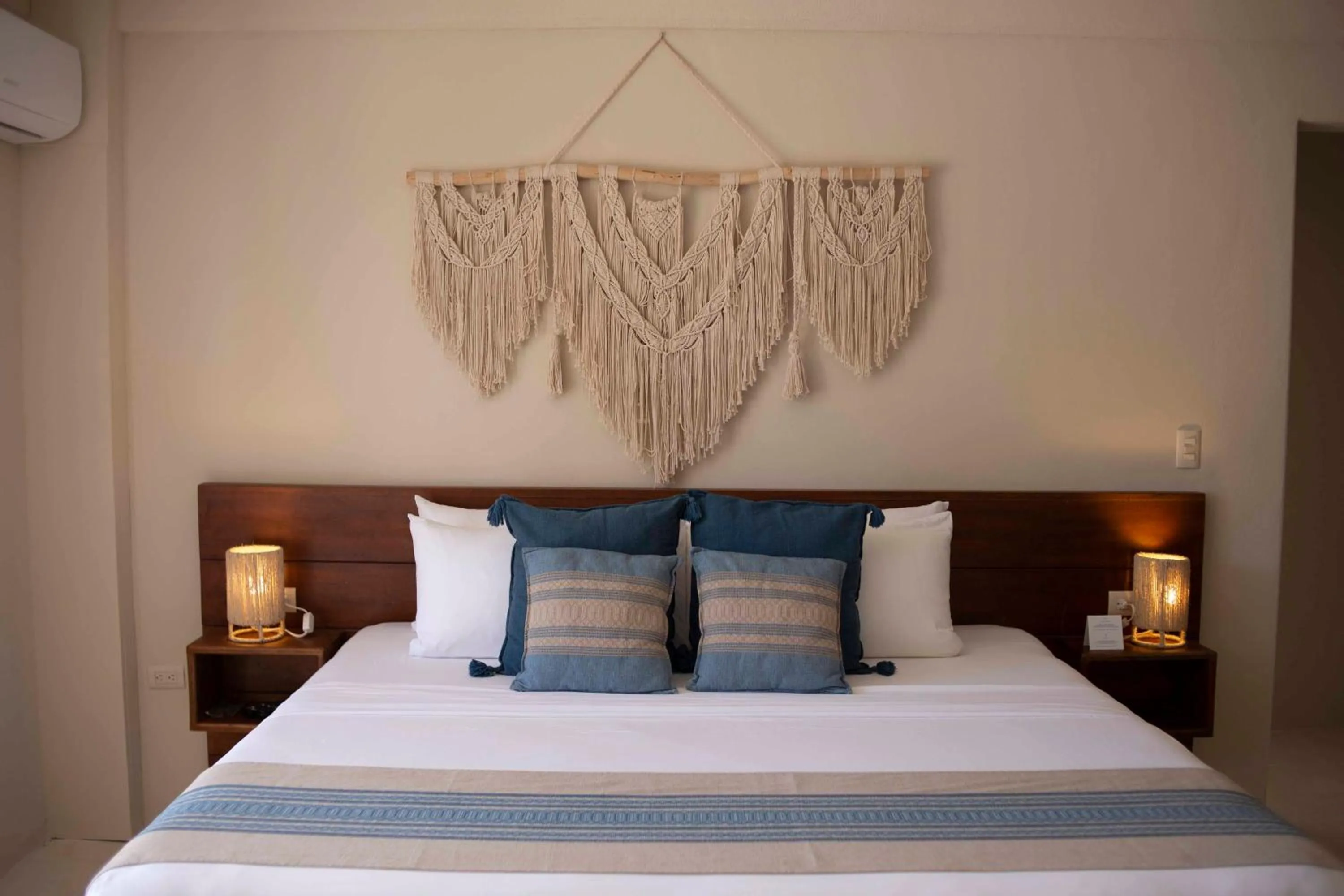 Bed in Noah Beach Hotel & Suites