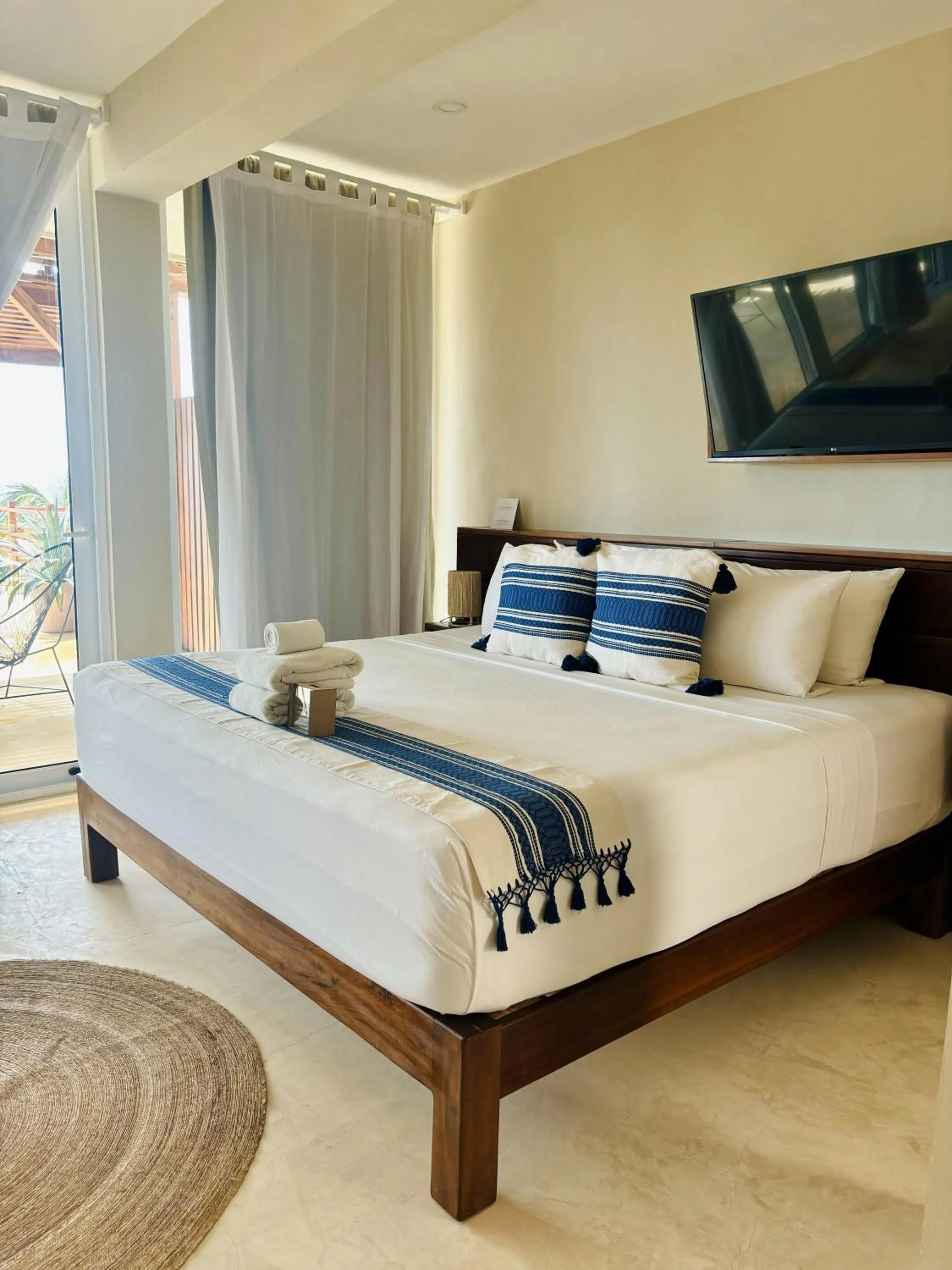 Bed in Noah Beach Hotel & Suites