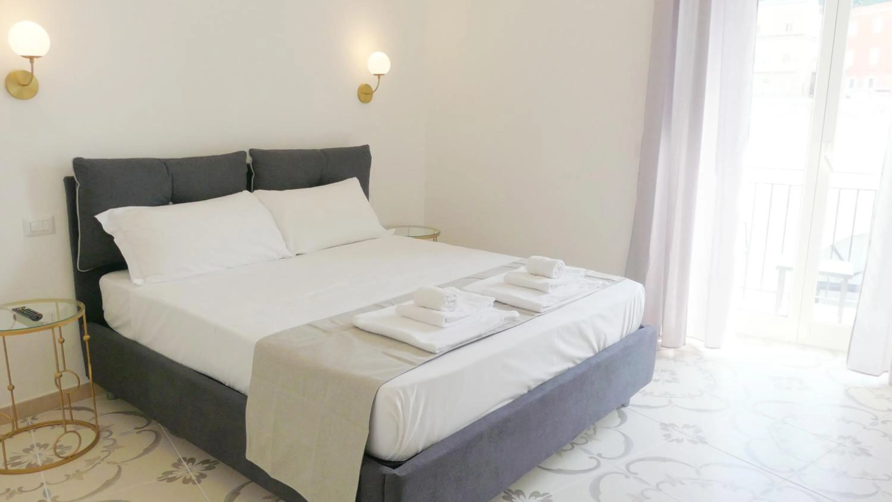Bed in Naro Suites and Rooms
