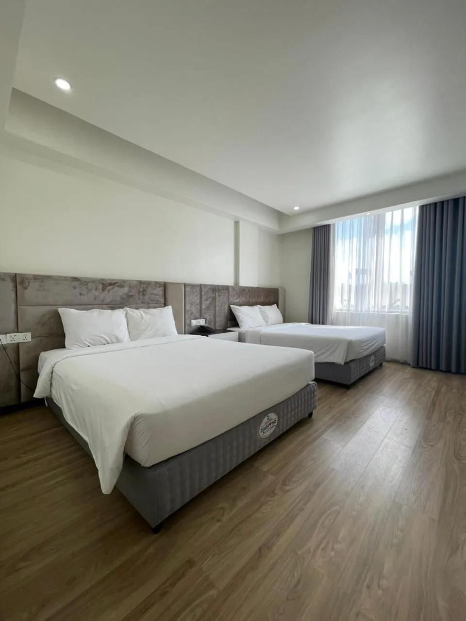 Bed in Lotus Hotel & Apartment