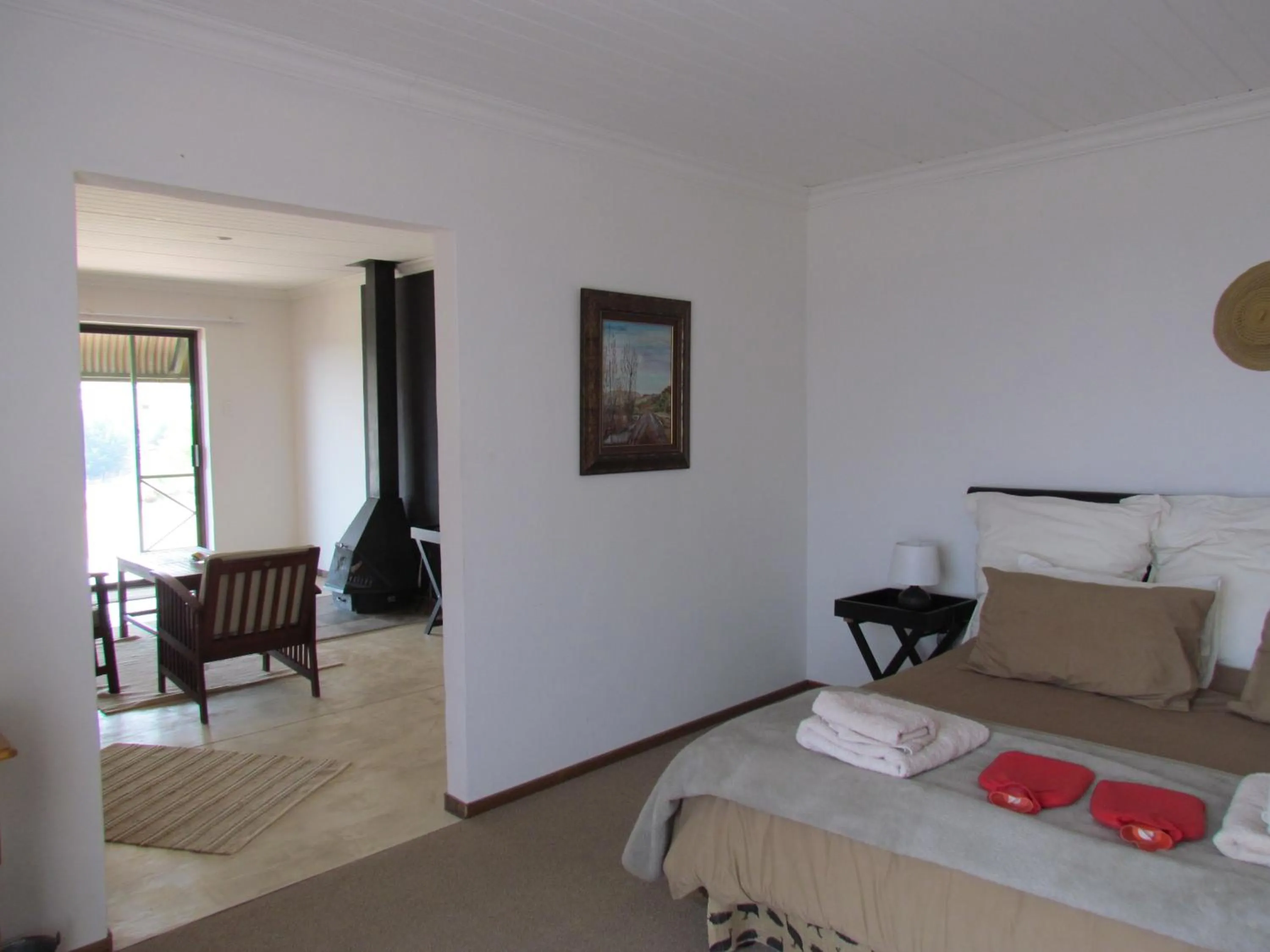 Seating area, Bed in Pumula Guest Farm