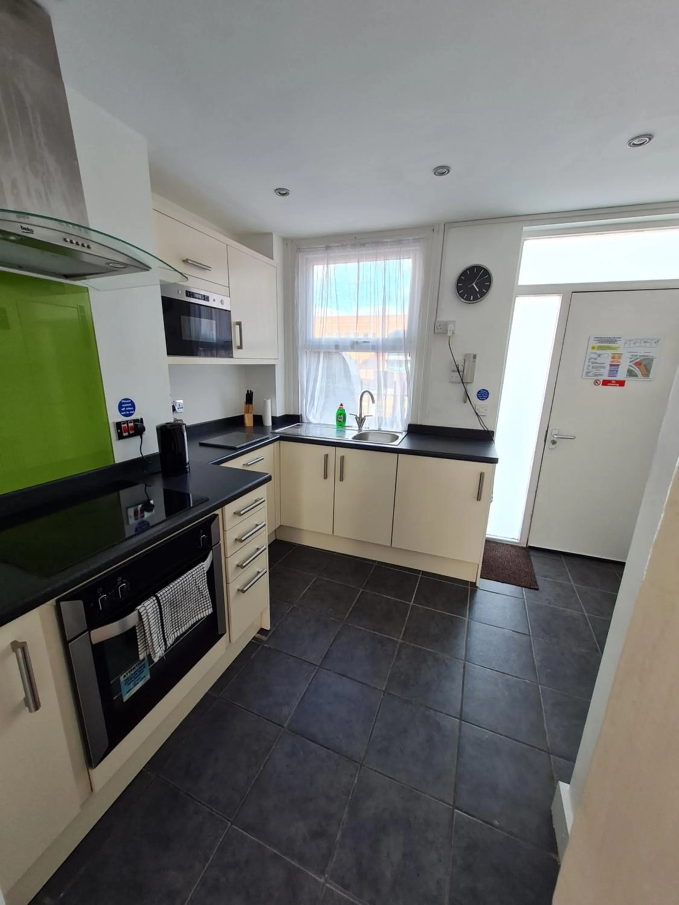 Kitchen or kitchenette in H.V Apartments