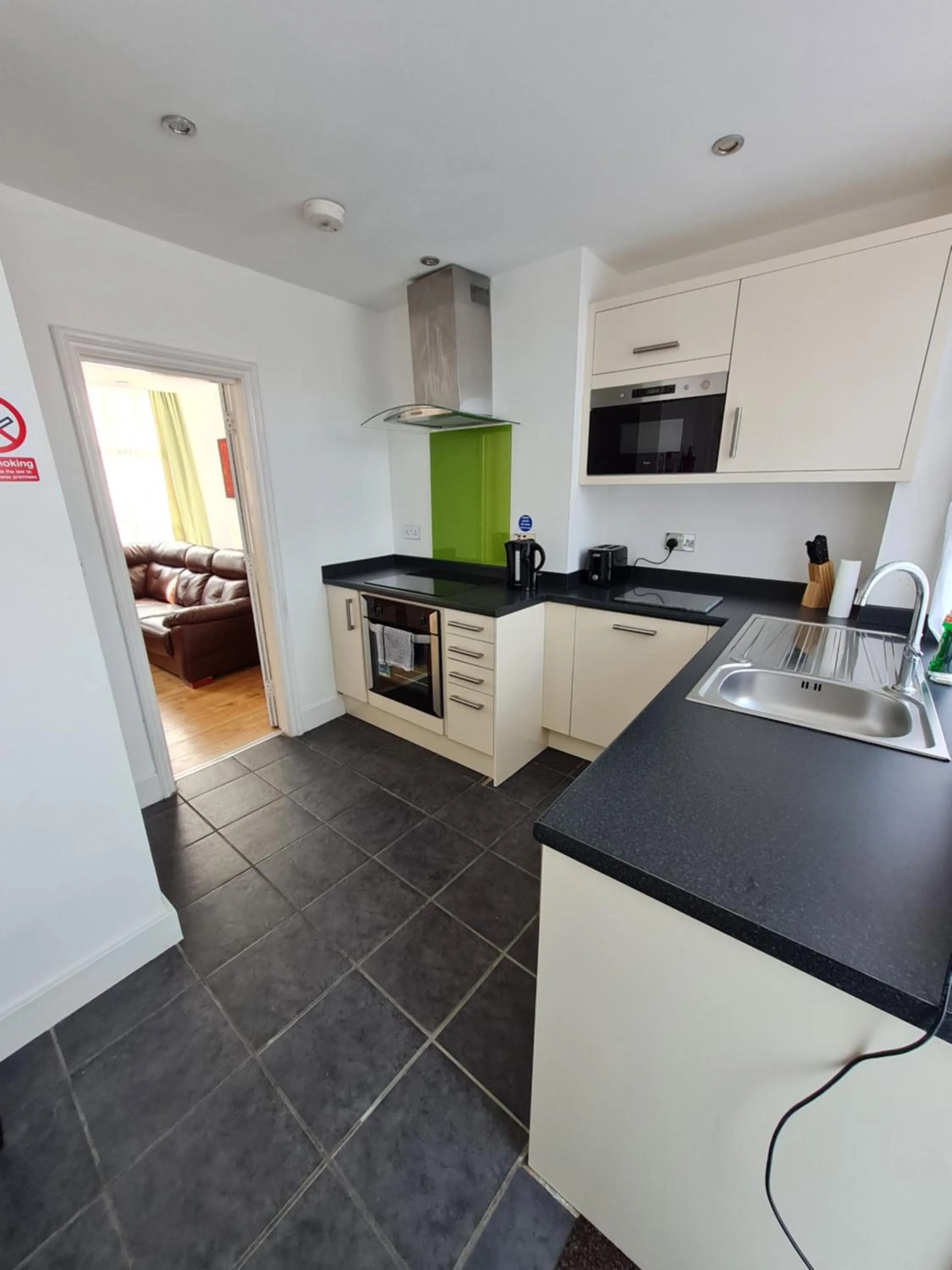 Kitchen or kitchenette in H.V Apartments