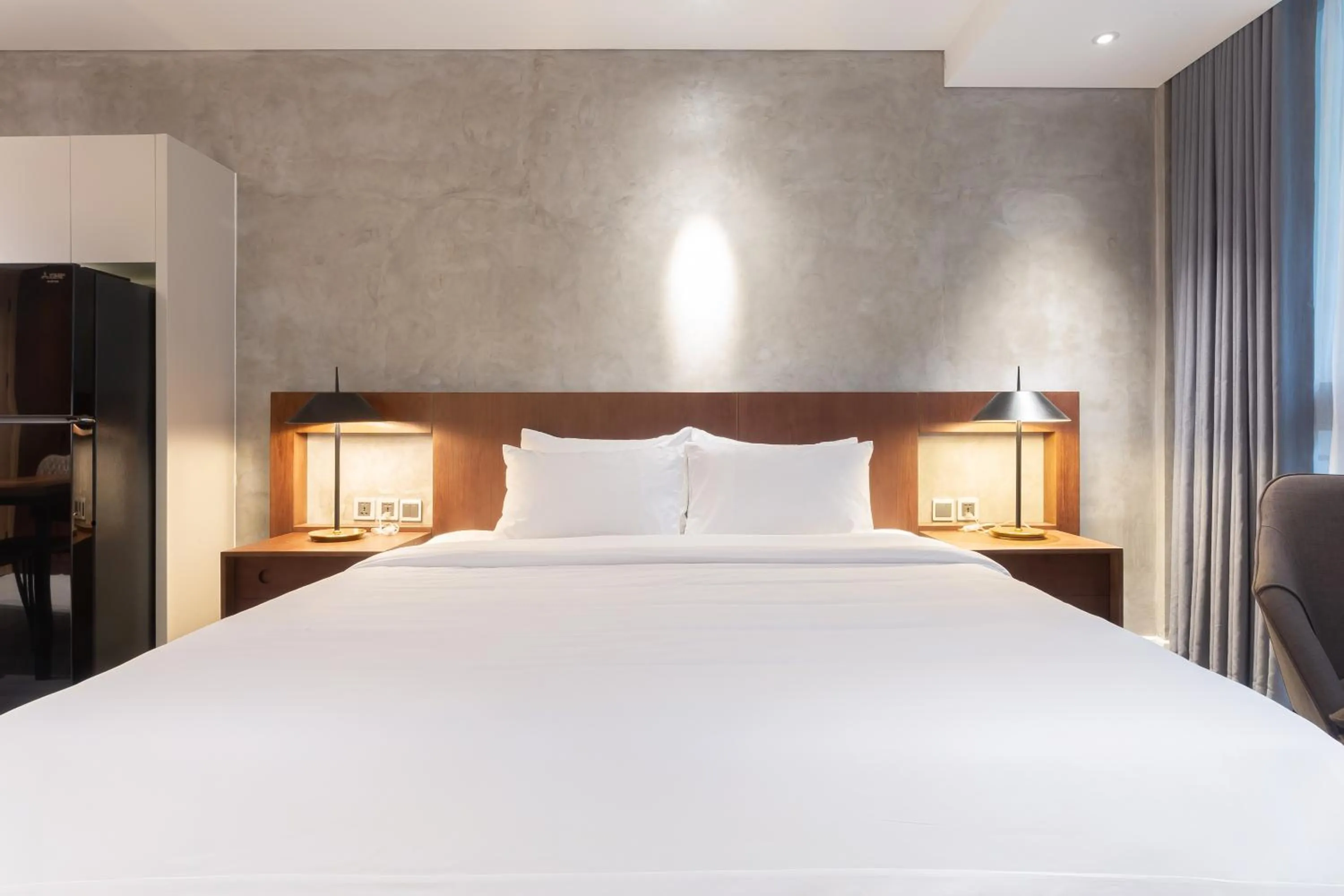 Bed in Bi Eco Suites Hanoi