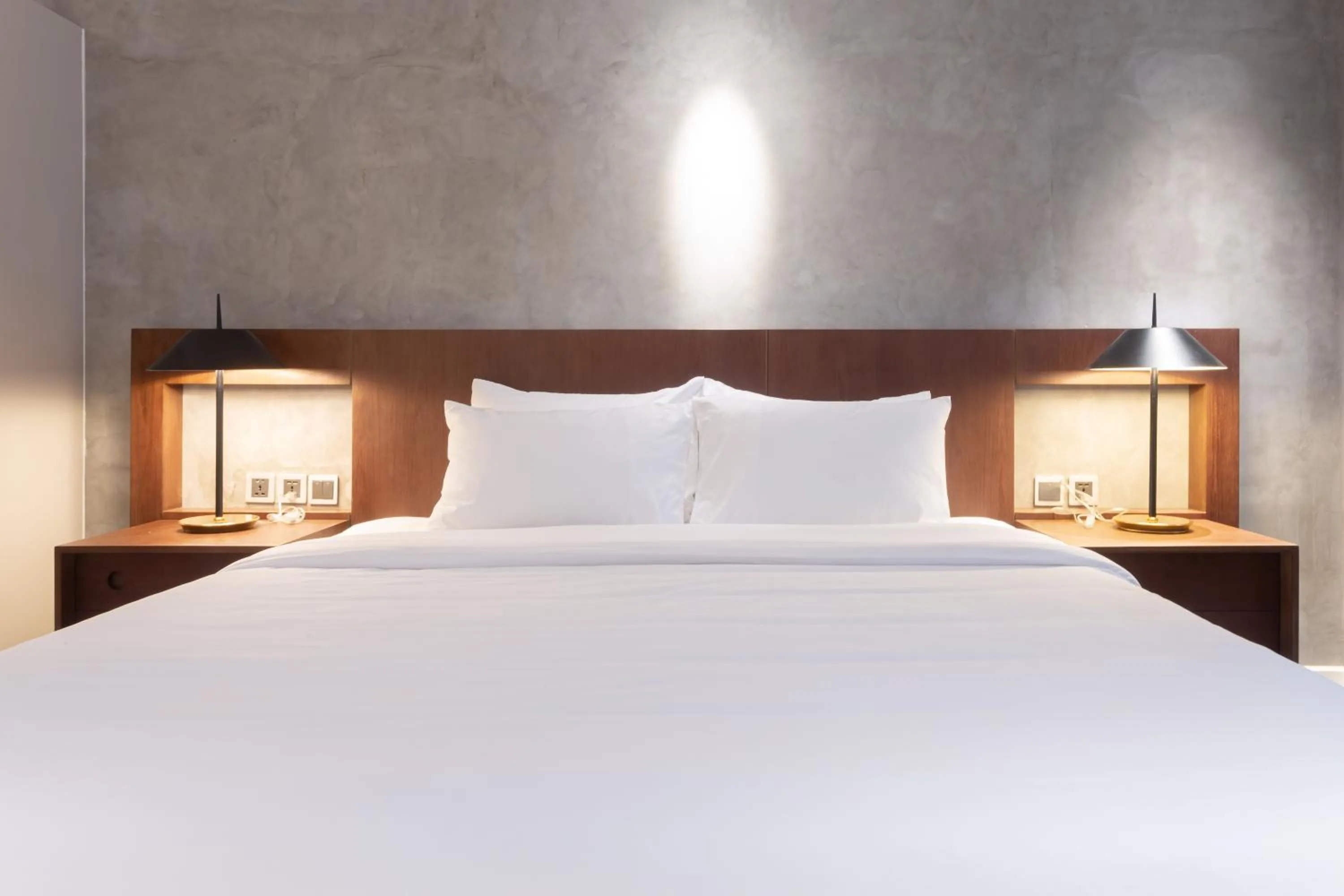 Bed in Bi Eco Suites Hanoi