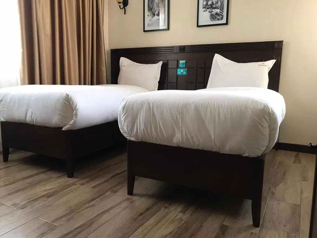 Bed in Hemak Suites