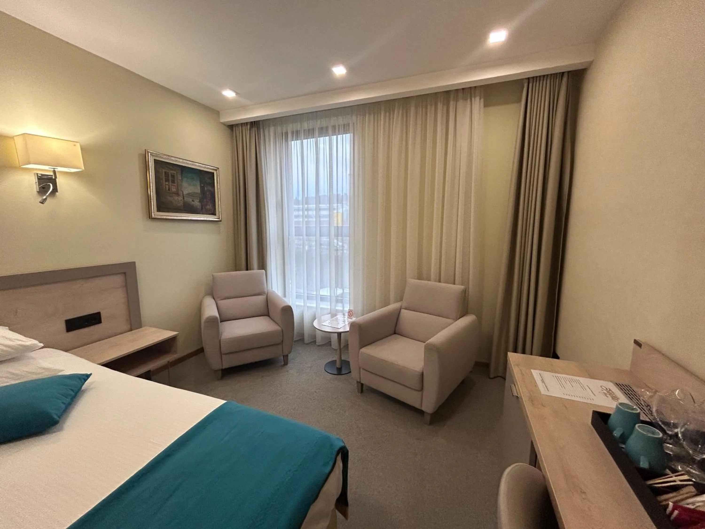 Living room, Bed in Hotel Siesta