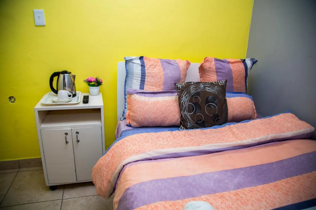 Bed in Relaxing Guest House in th Heart of Ndabeni