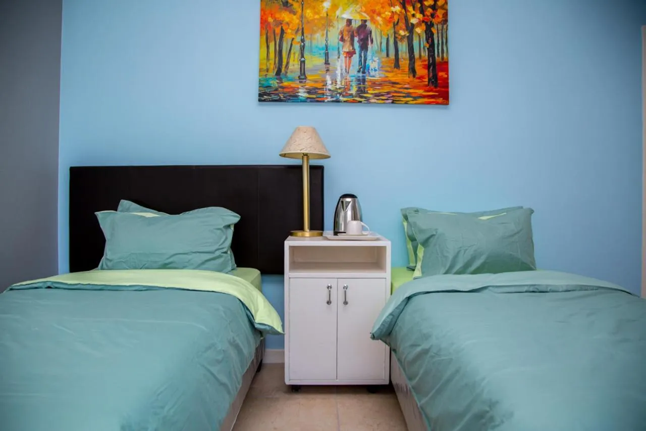 Bed in Relaxing Guest House in th Heart of Ndabeni